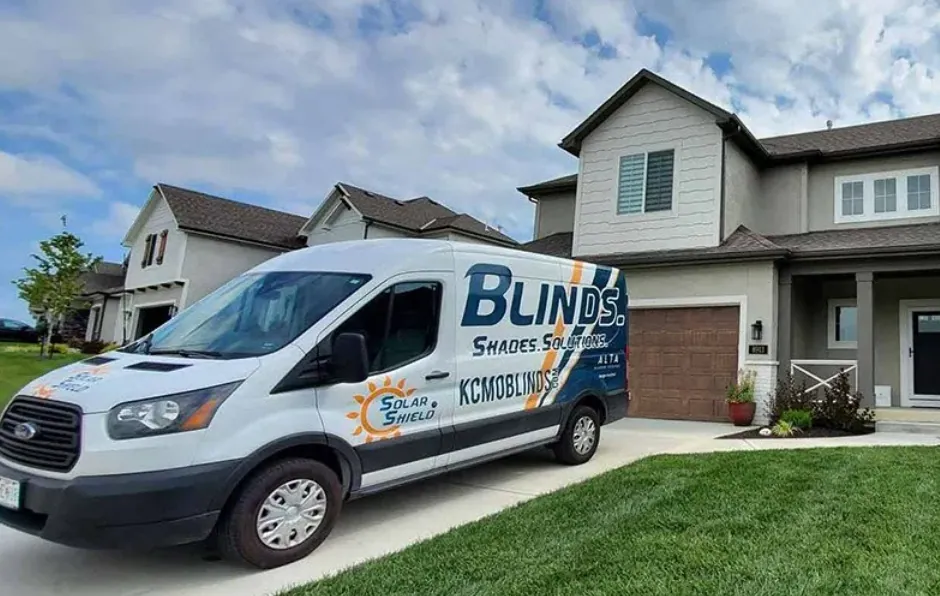 Solar Shield Blinds fleet vehicles parked at an installation project