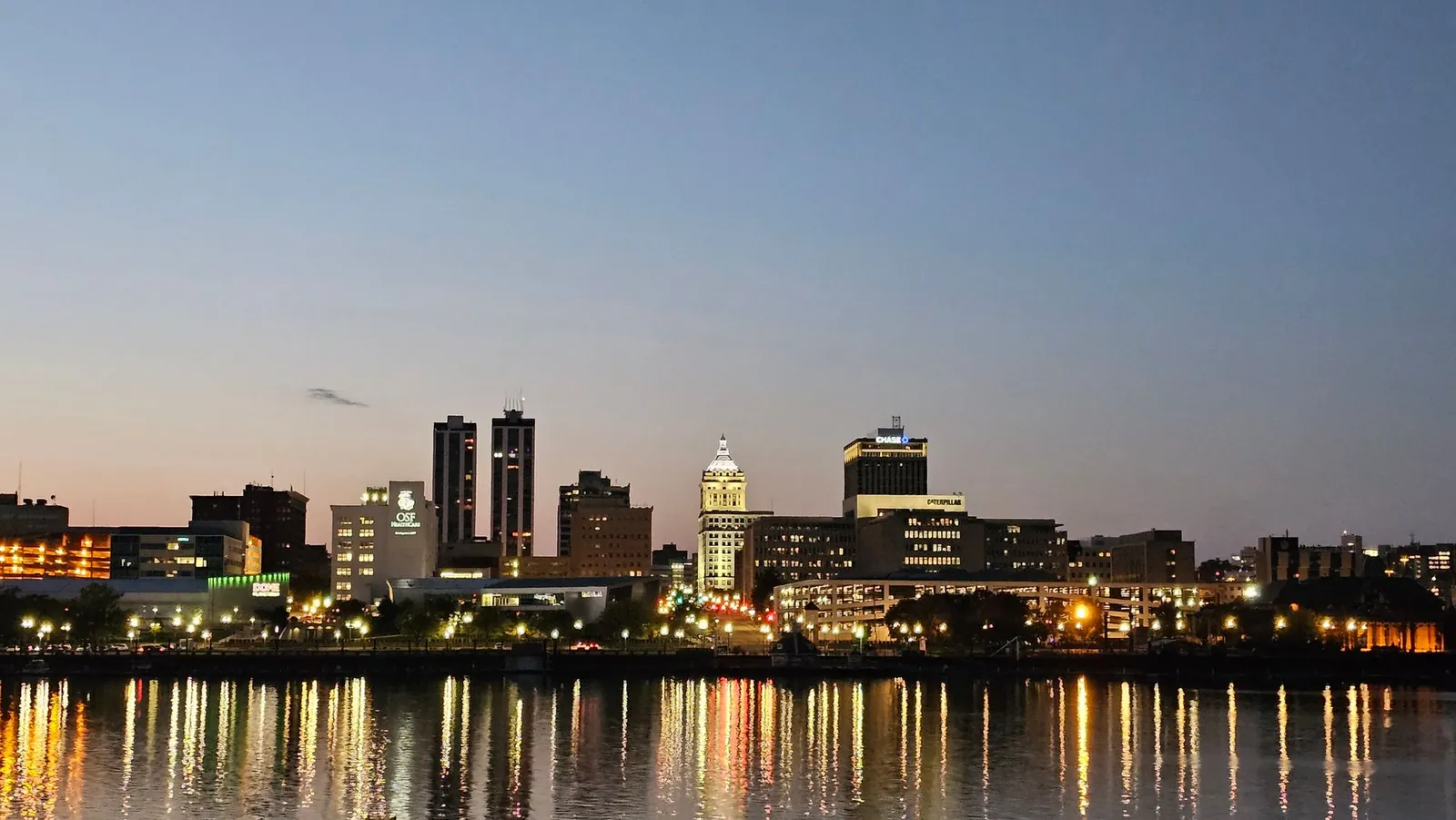 City skyline reflected in the river at dusk