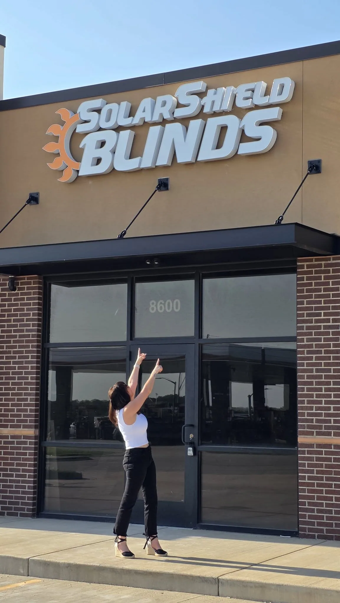 The Solar Shield Blinds storefront with the sign above the entrance