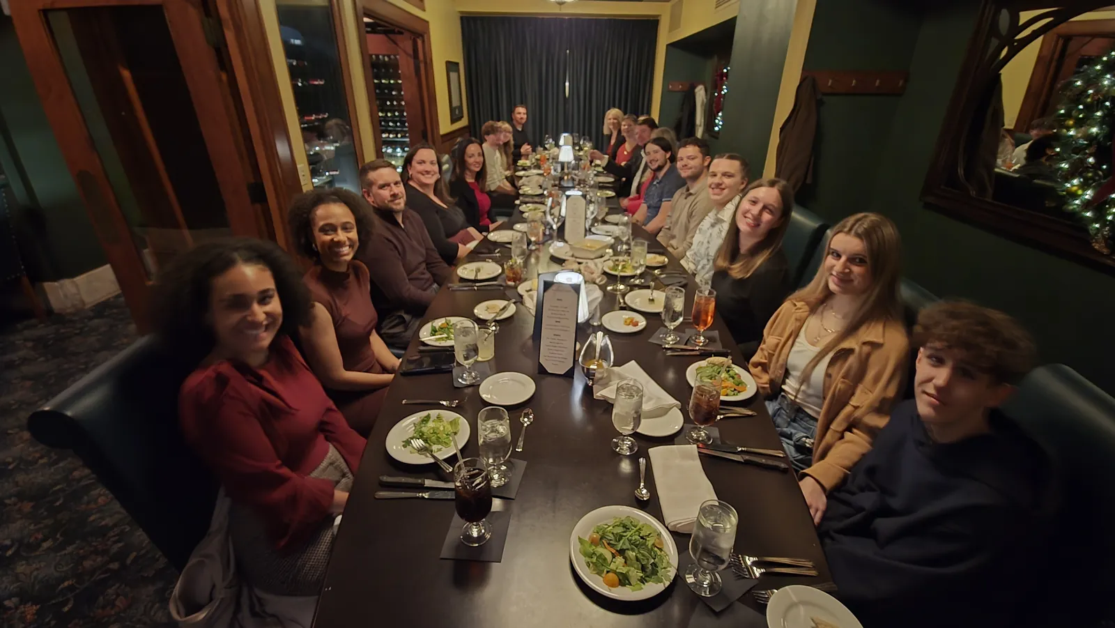 A team dinner around one long table