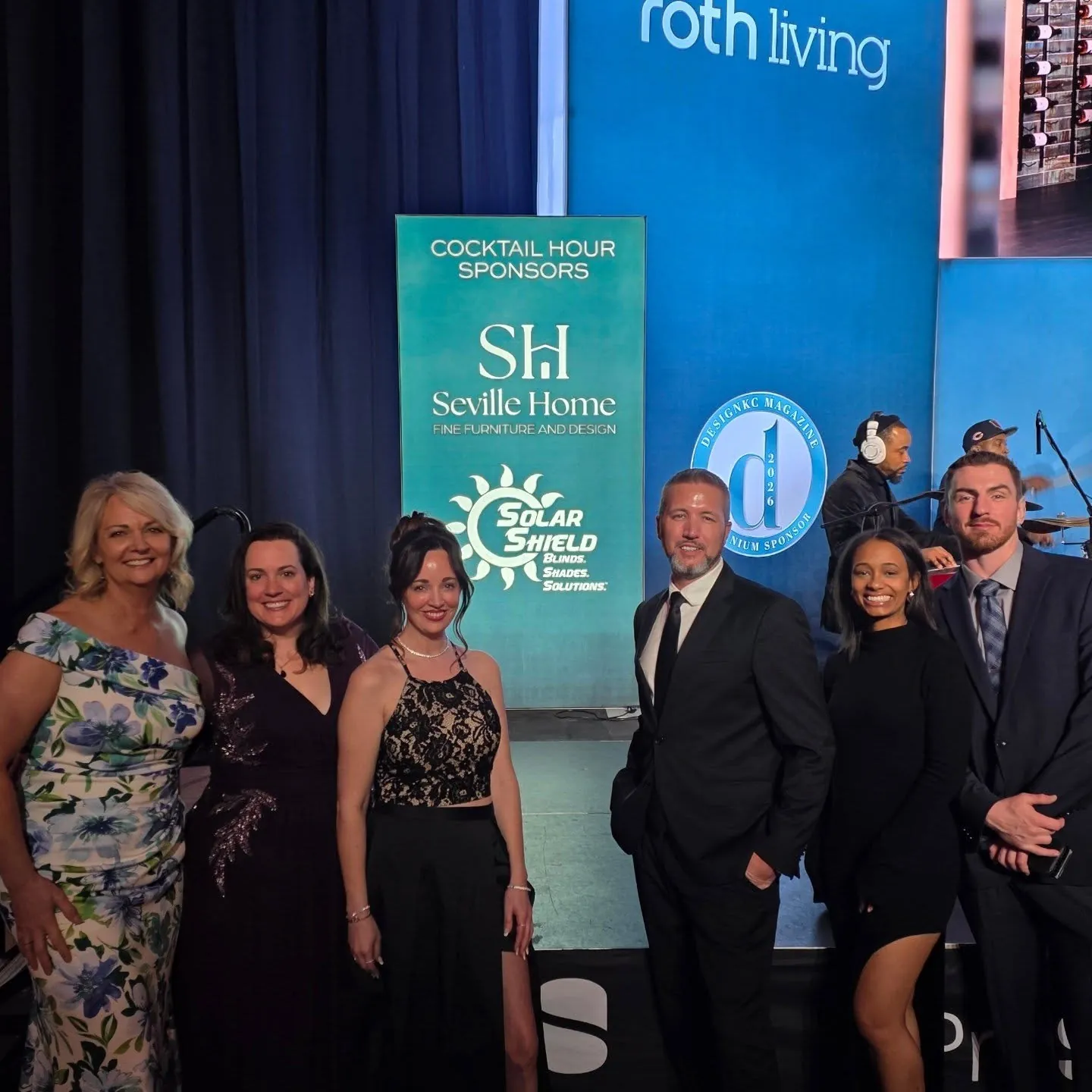 The team in formal wear at a gala the company sponsored