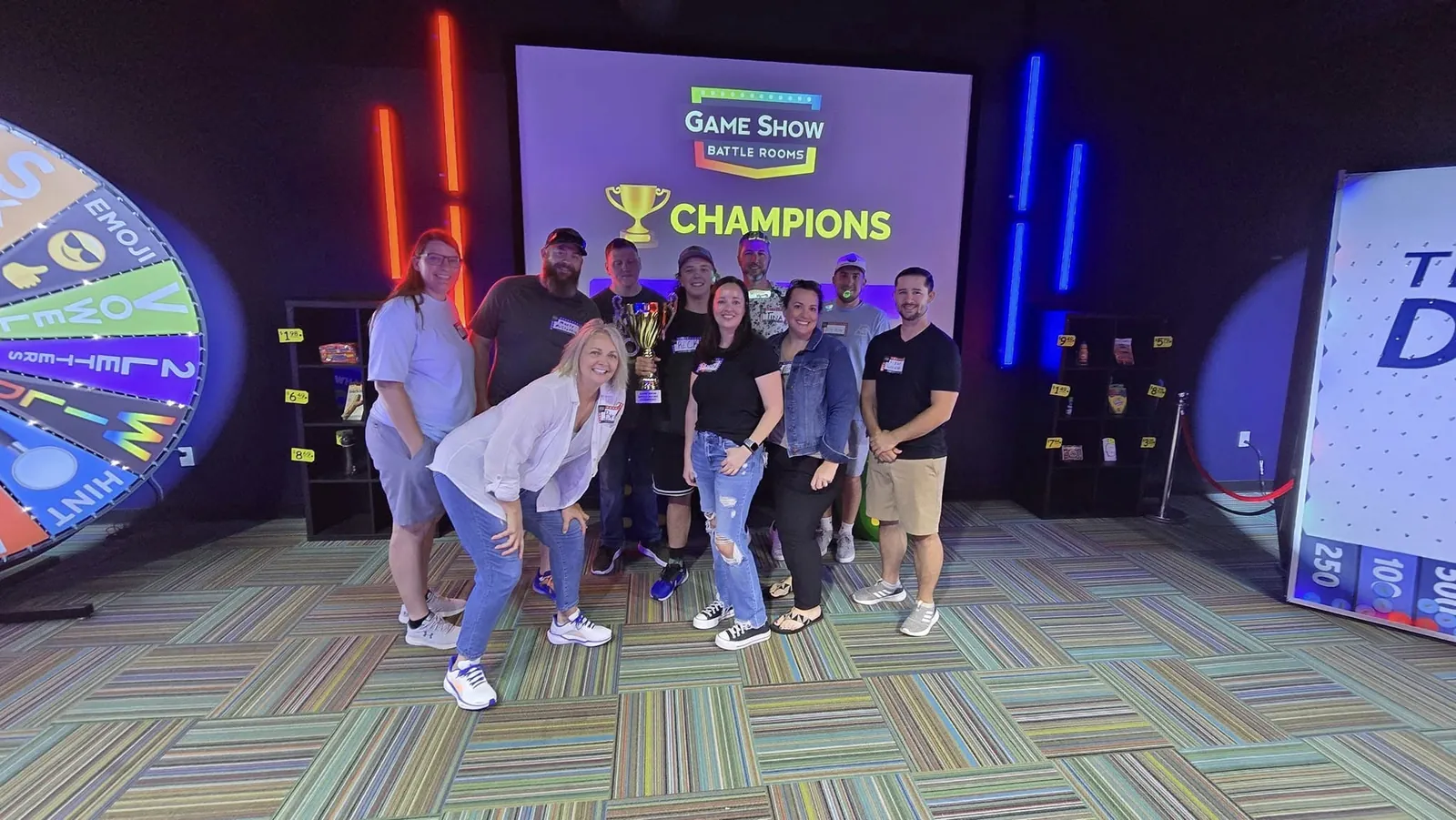 The team celebrating a win at a game show event
