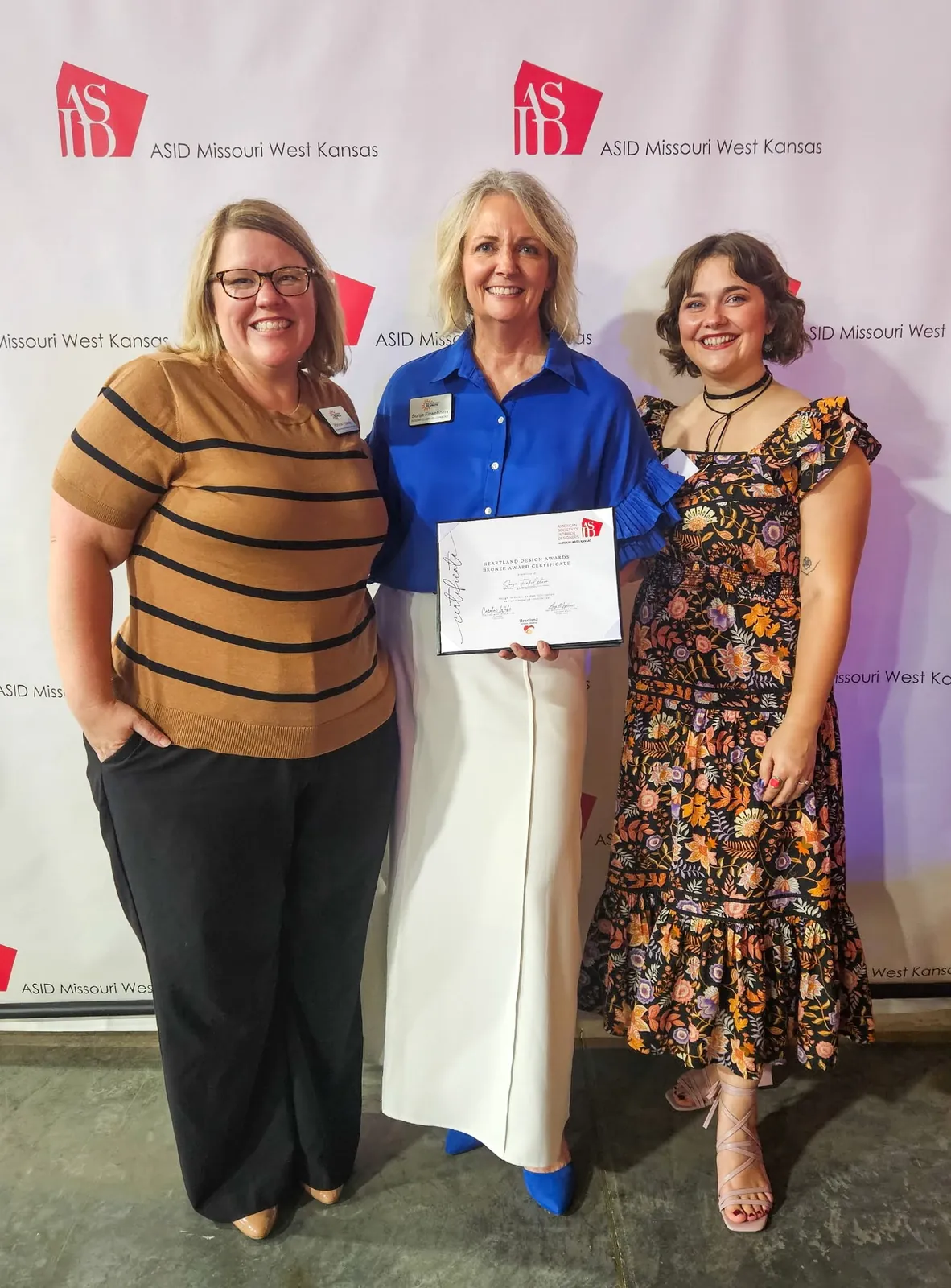 A team member receiving an award certificate at an event