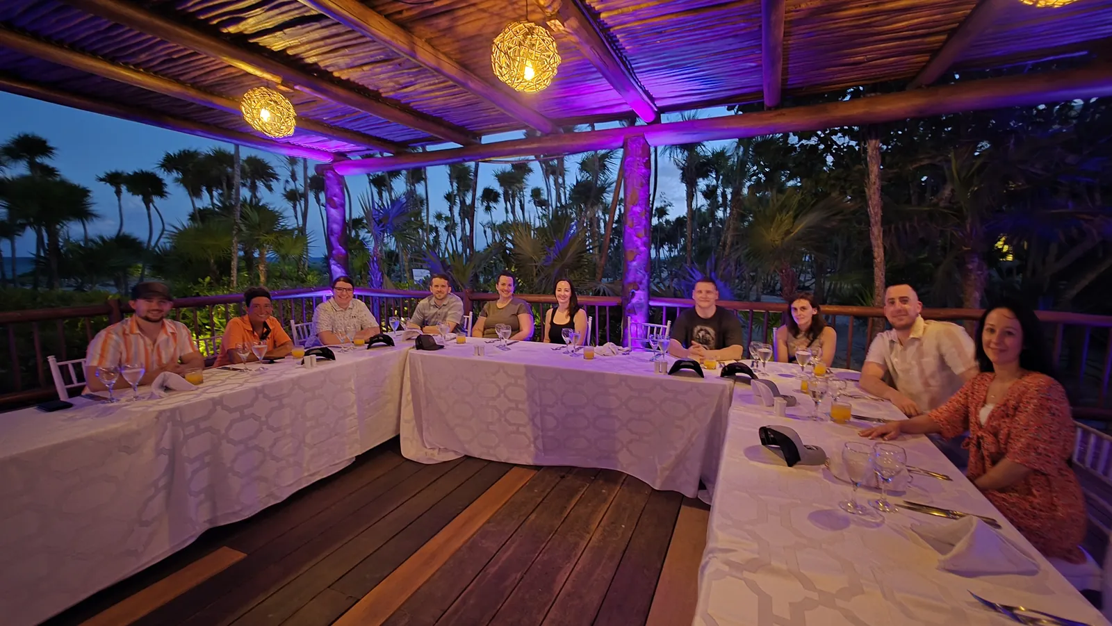 A team dinner on a lantern lit terrace during a company trip
