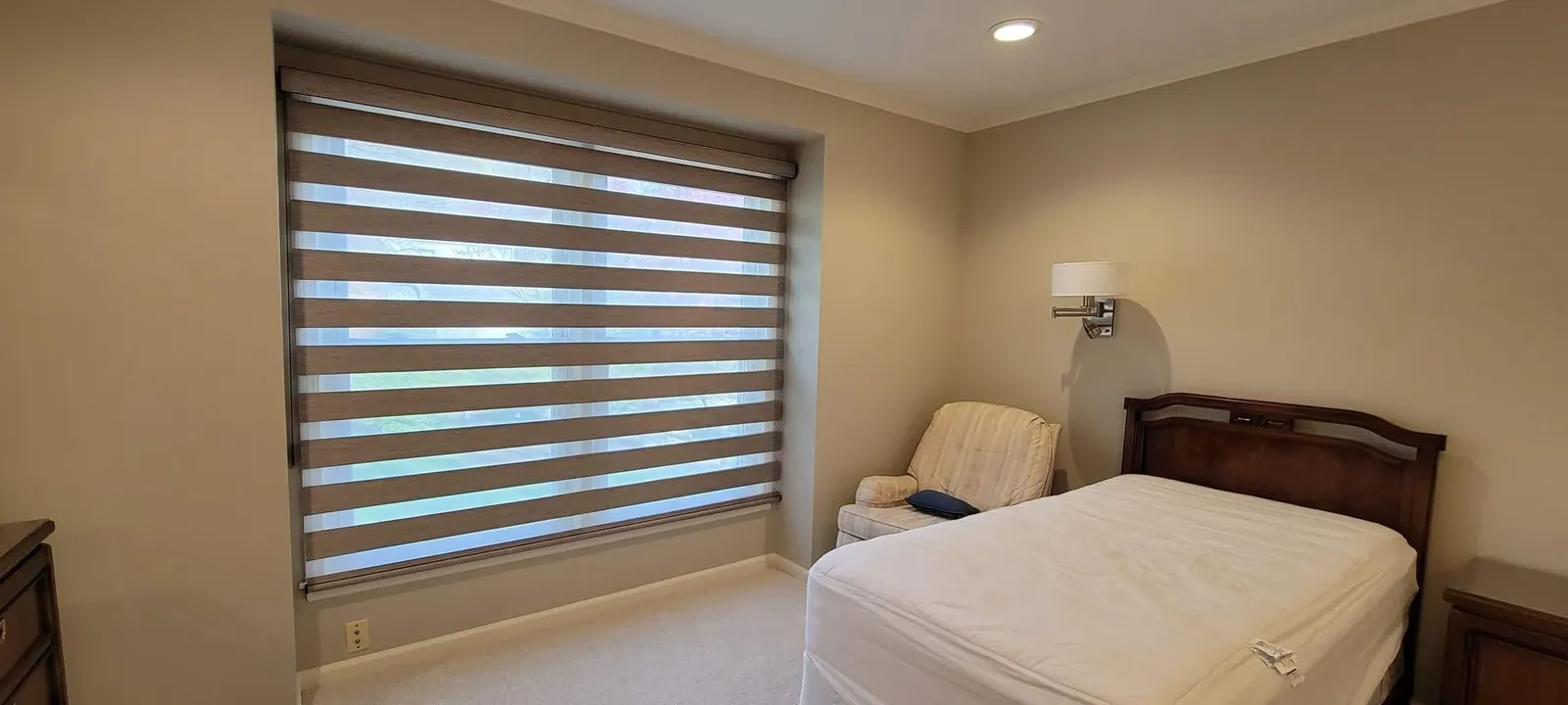 Banded shades on large bedroom windows