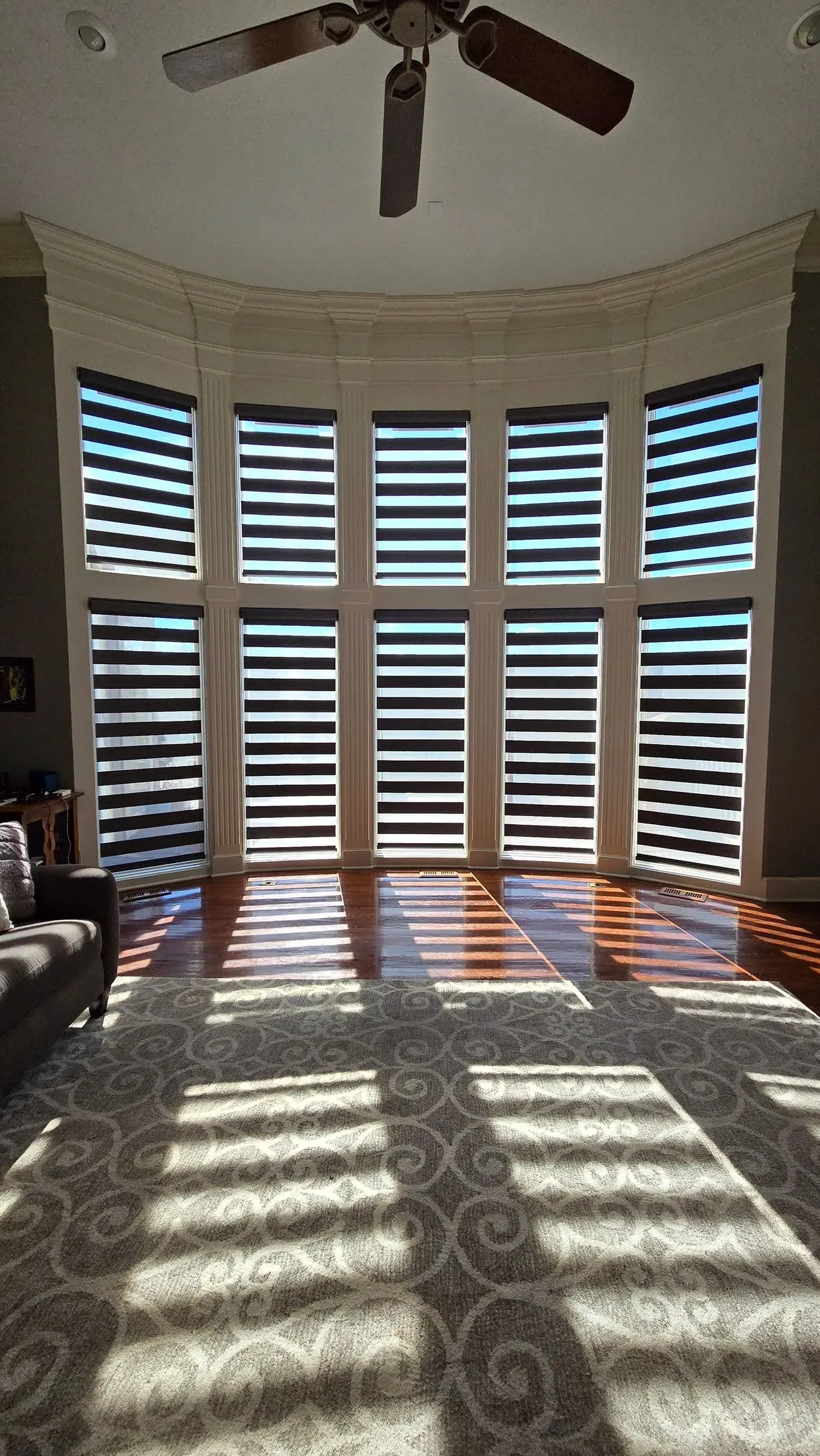 Banded Shades curved bay window living room solar shield blinds, installed by Solar Shield Blinds