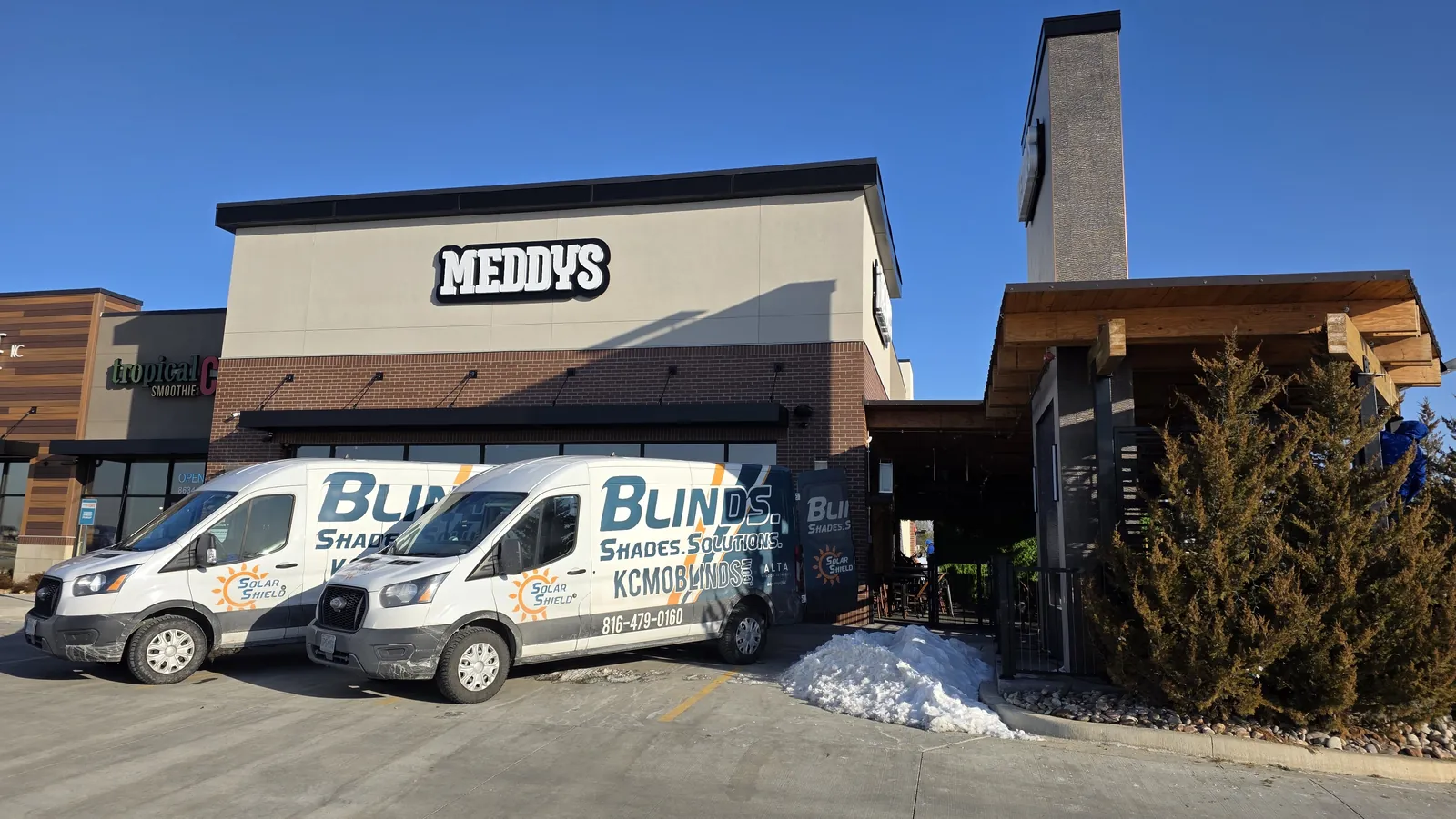 Solar Shield Blinds vans outside Meddy's restaurant