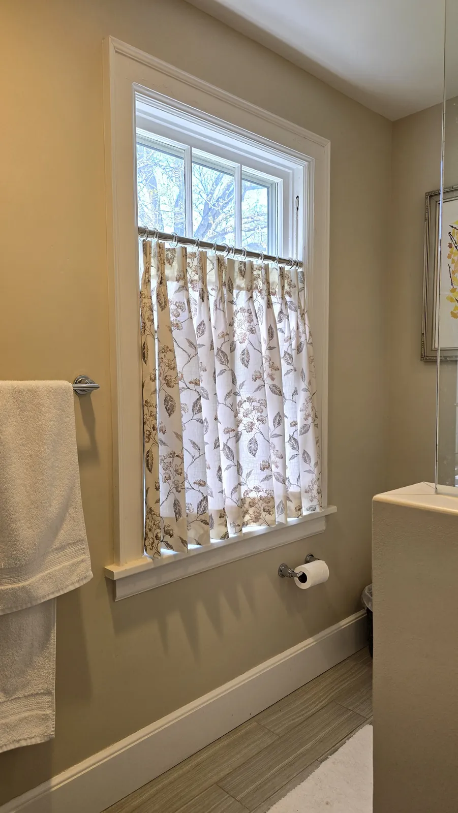 Floral café curtains on a bathroom window, installed by Solar Shield Blinds