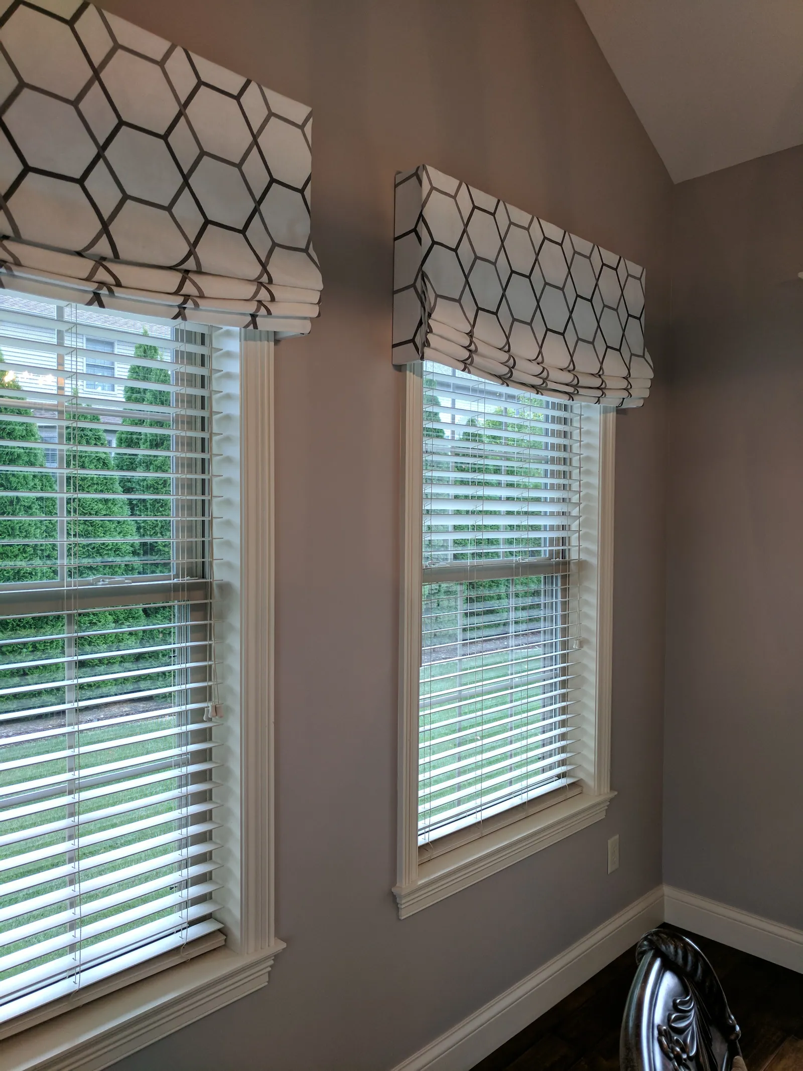 Patterned cornices over blinds, installed by Solar Shield Blinds