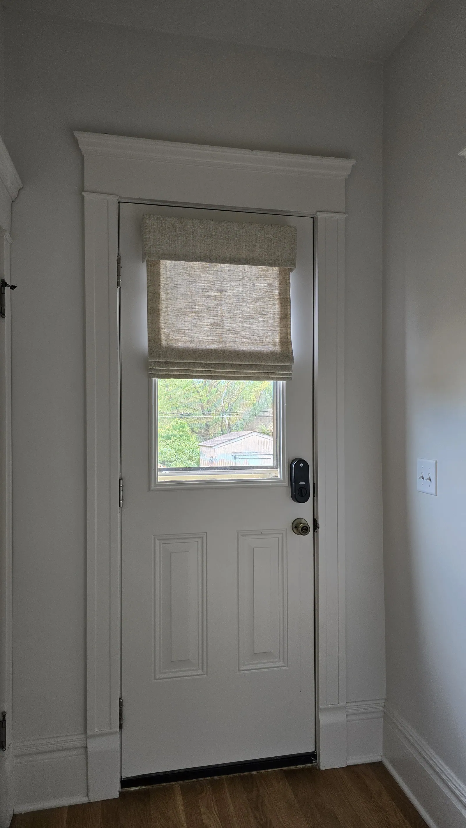Drapery & Soft Treatments and roman shades door window, installed by Solar Shield Blinds