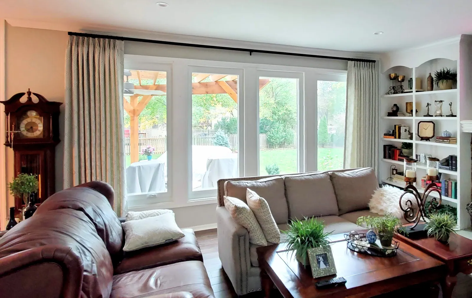 Sheer curtains on living room windows, installed by Solar Shield Blinds