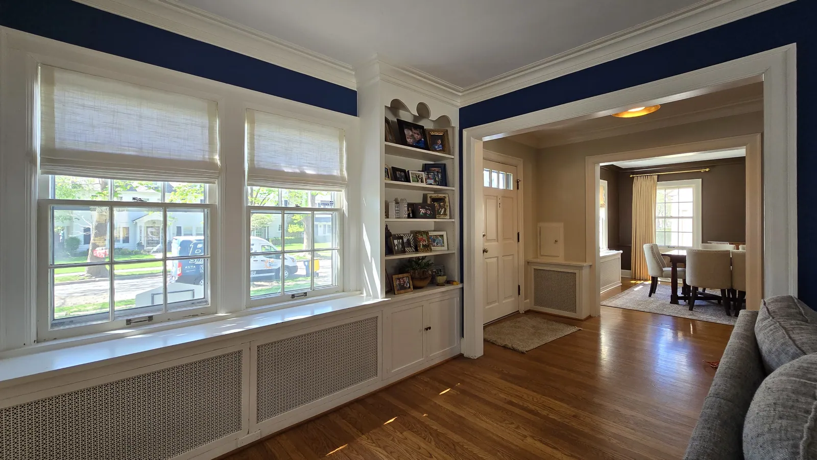 Living room roman shades, installed by Solar Shield Blinds