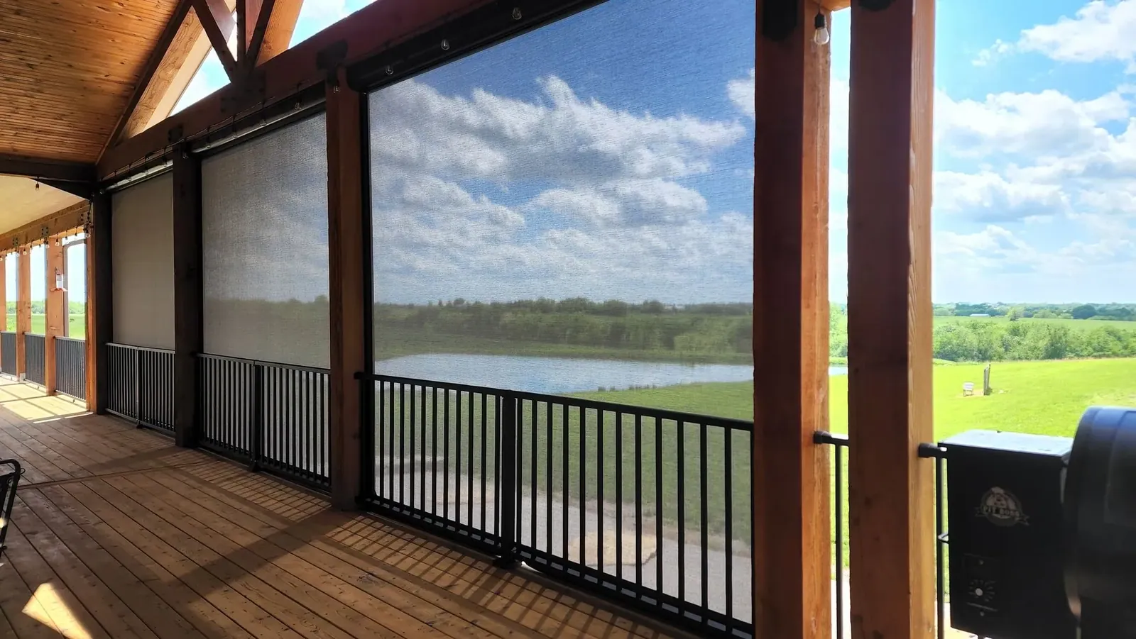 Custom exterior patio shades fully closed large in a deck, installed by Solar Shield Blinds