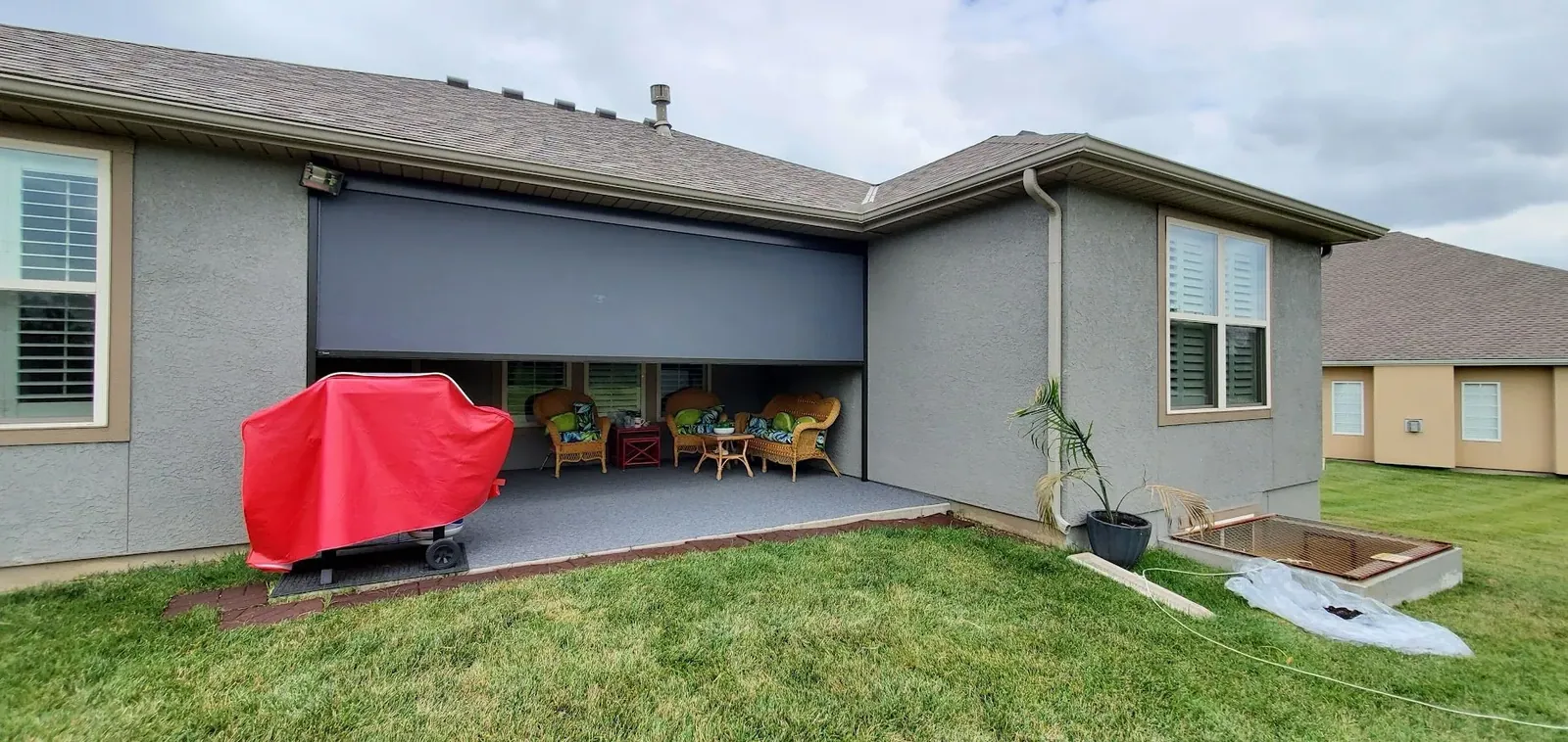 Exterior Patio Shades half closed, installed by Solar Shield Blinds
