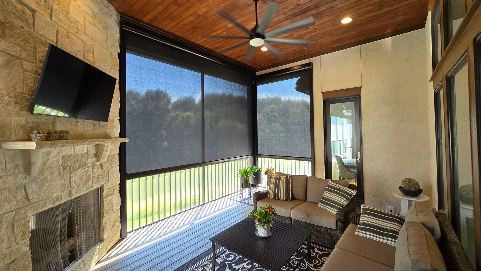 Exterior Patio Shades half lowered motorized, a Solar Shield Blinds install