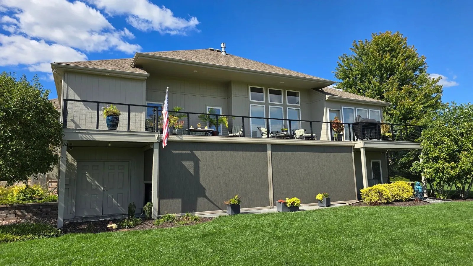 Exterior Patio Shades lower deck multilevel house, installed by Solar Shield Blinds