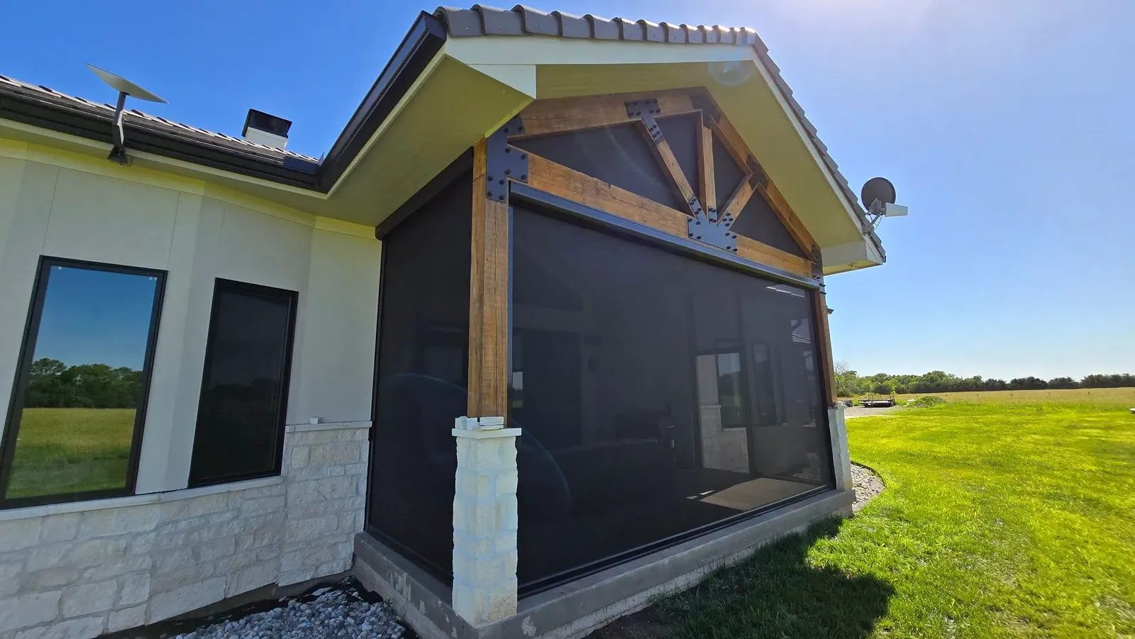 Custom exterior patio shades on a lower patio, installed by Solar Shield Blinds