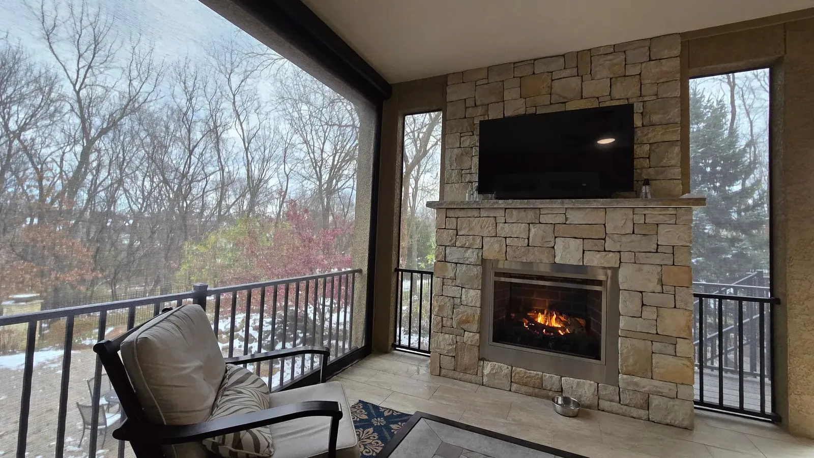 Exterior patio shades lowered on a patio with snow on the ground outside