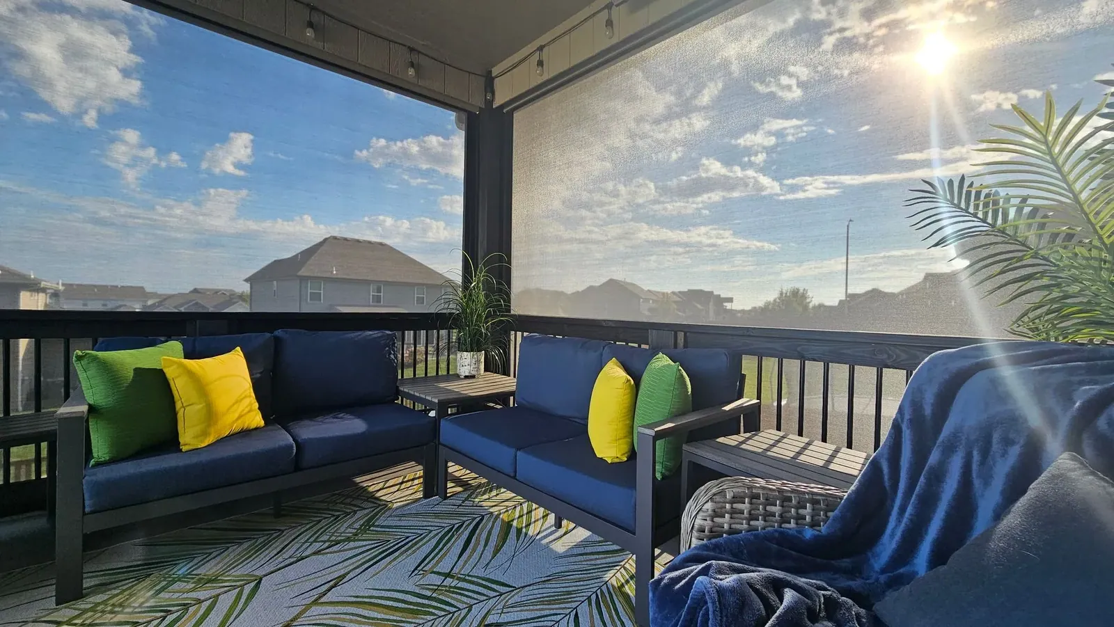 Exterior patio shades sunny weather shades down blocking sun, installed by Solar Shield Blinds