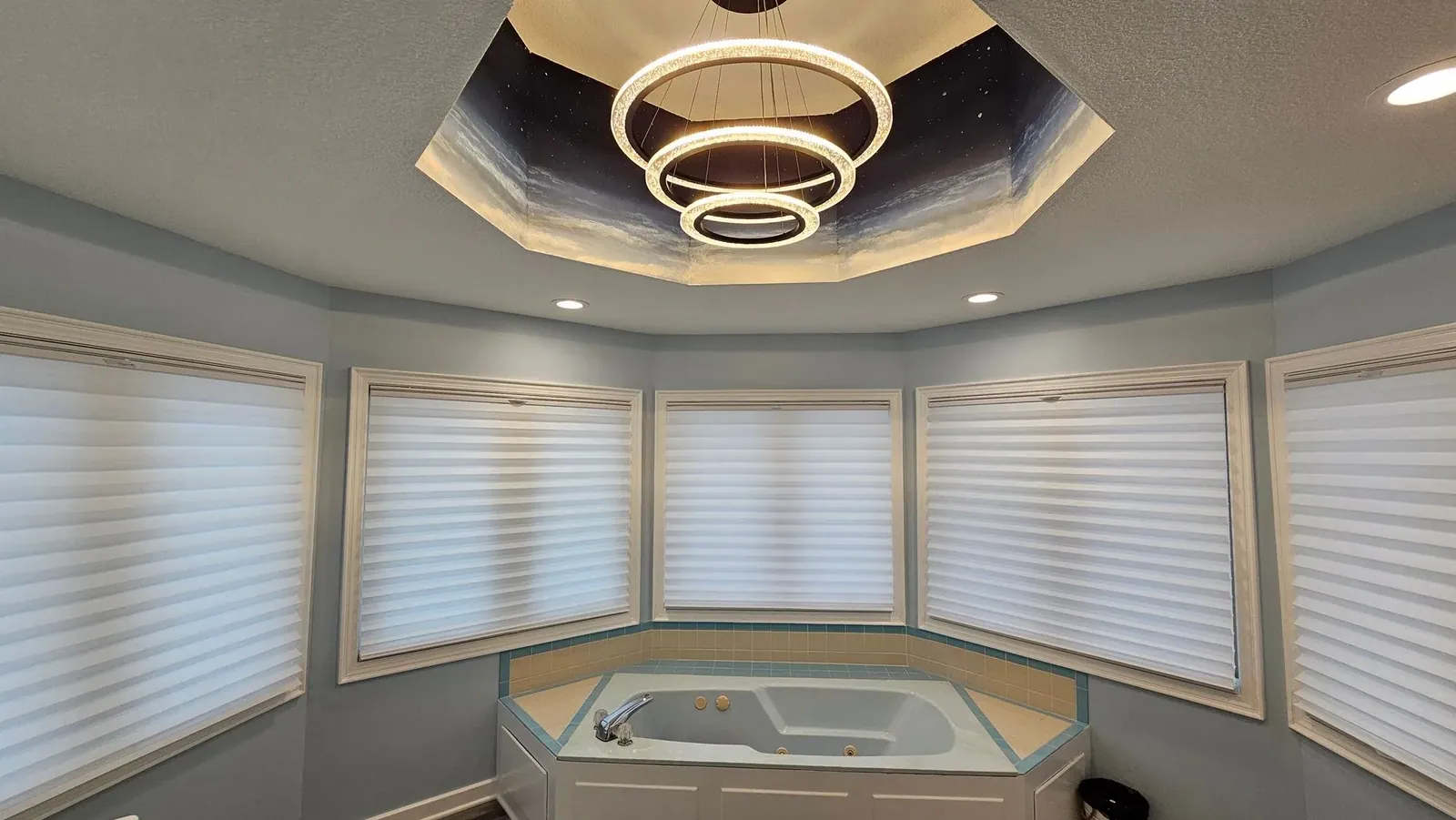 Honeycomb shades in a top down bottom up configuration above a bathroom tub