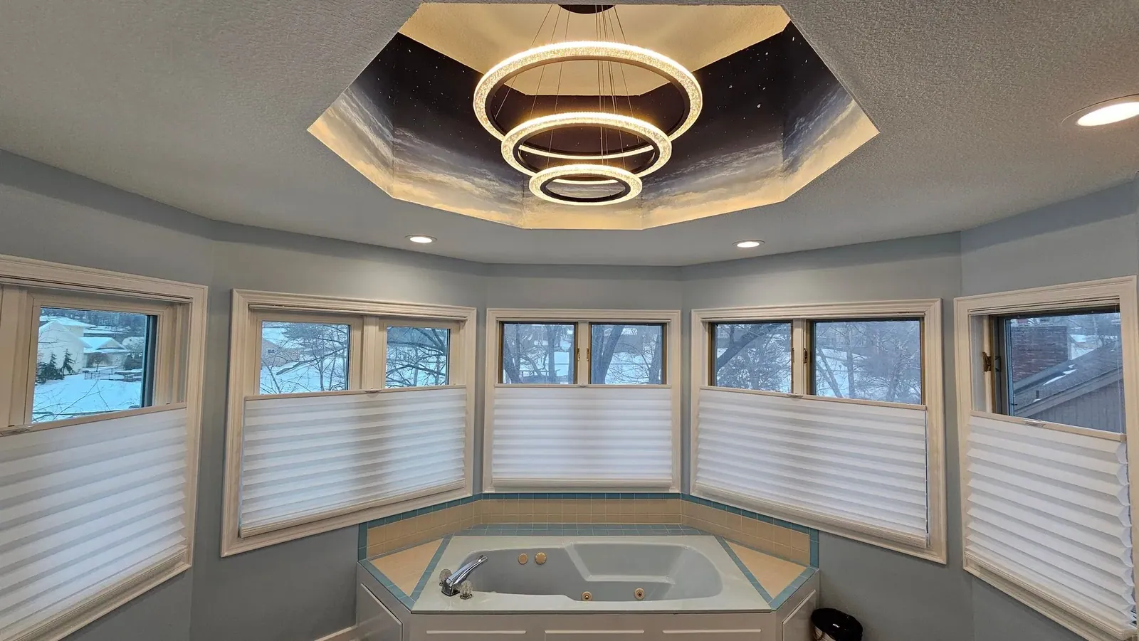 Custom honeycomb shades half closed above a bathroom tub top down, installed by Solar Shield Blinds