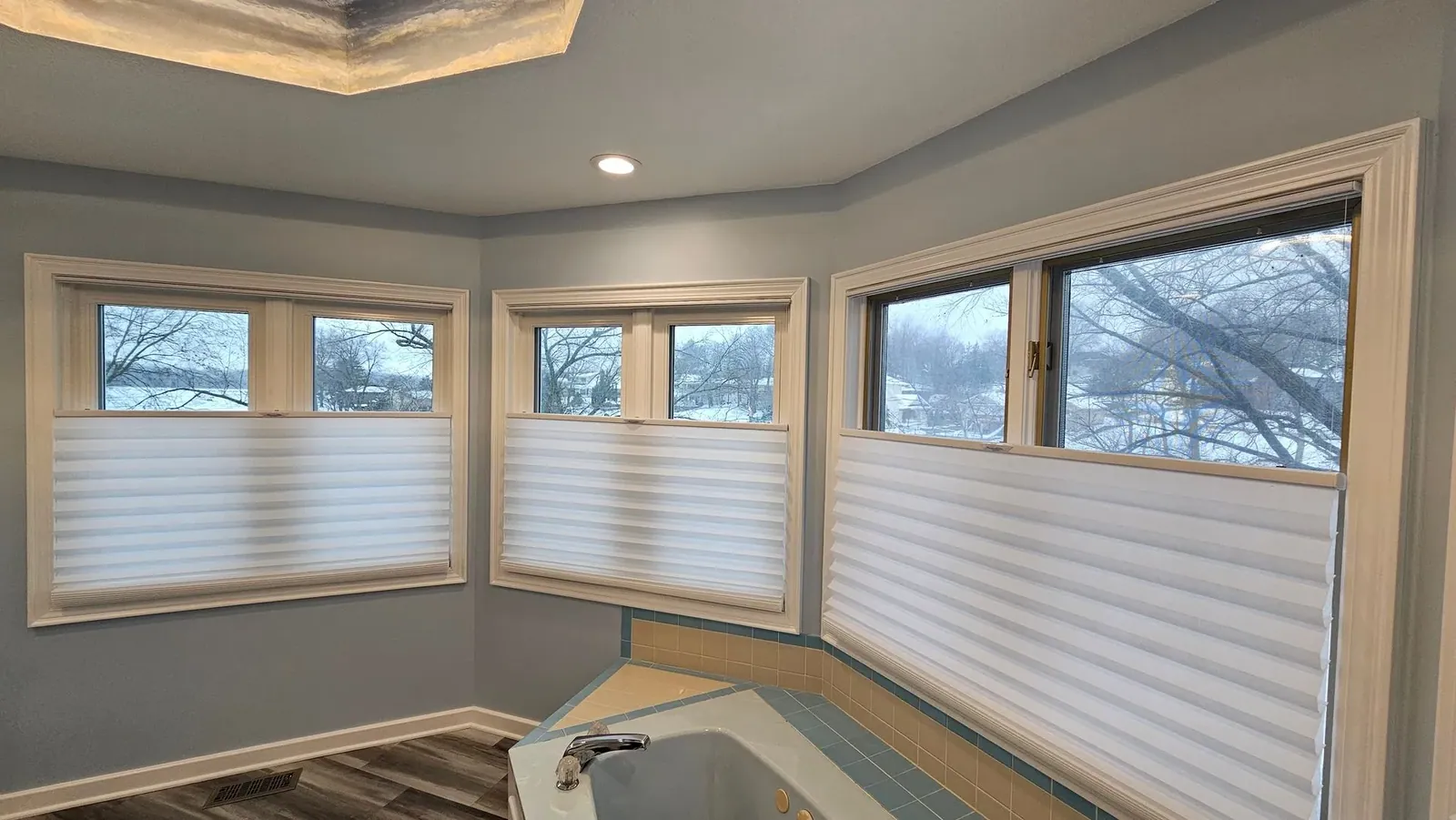 Honeycomb Shades half closed side angle above a bathroom, a Solar Shield Blinds install