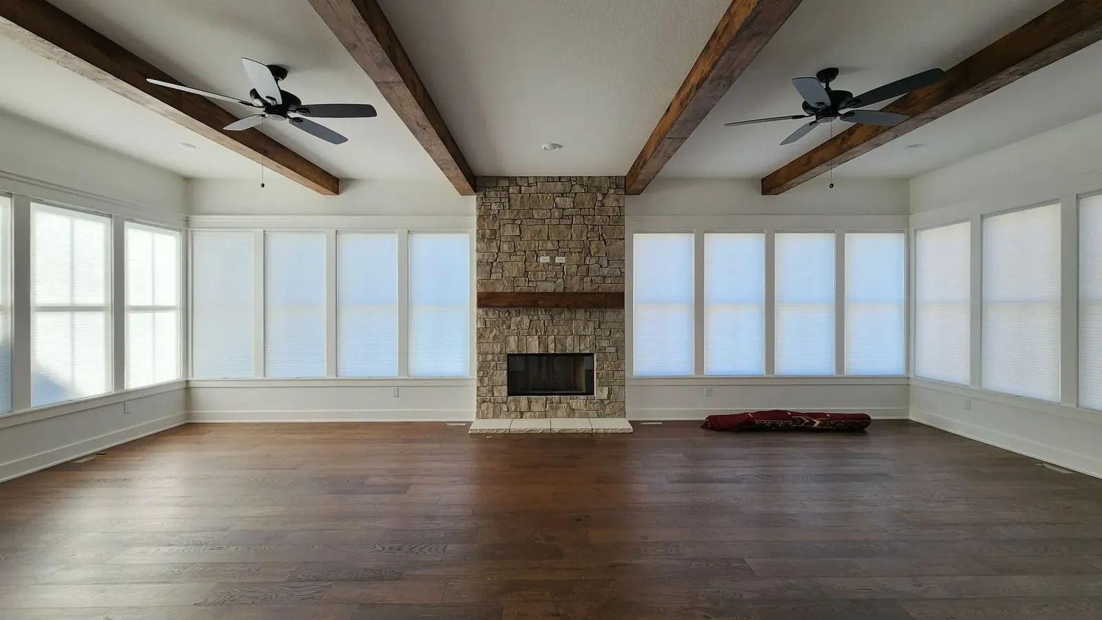 Honeycomb Shades closed living room with fireplace, installed by Solar Shield Blinds