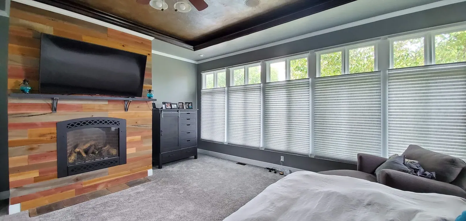 Motorized honeycomb shades in a living room, installed by Solar Shield Blinds