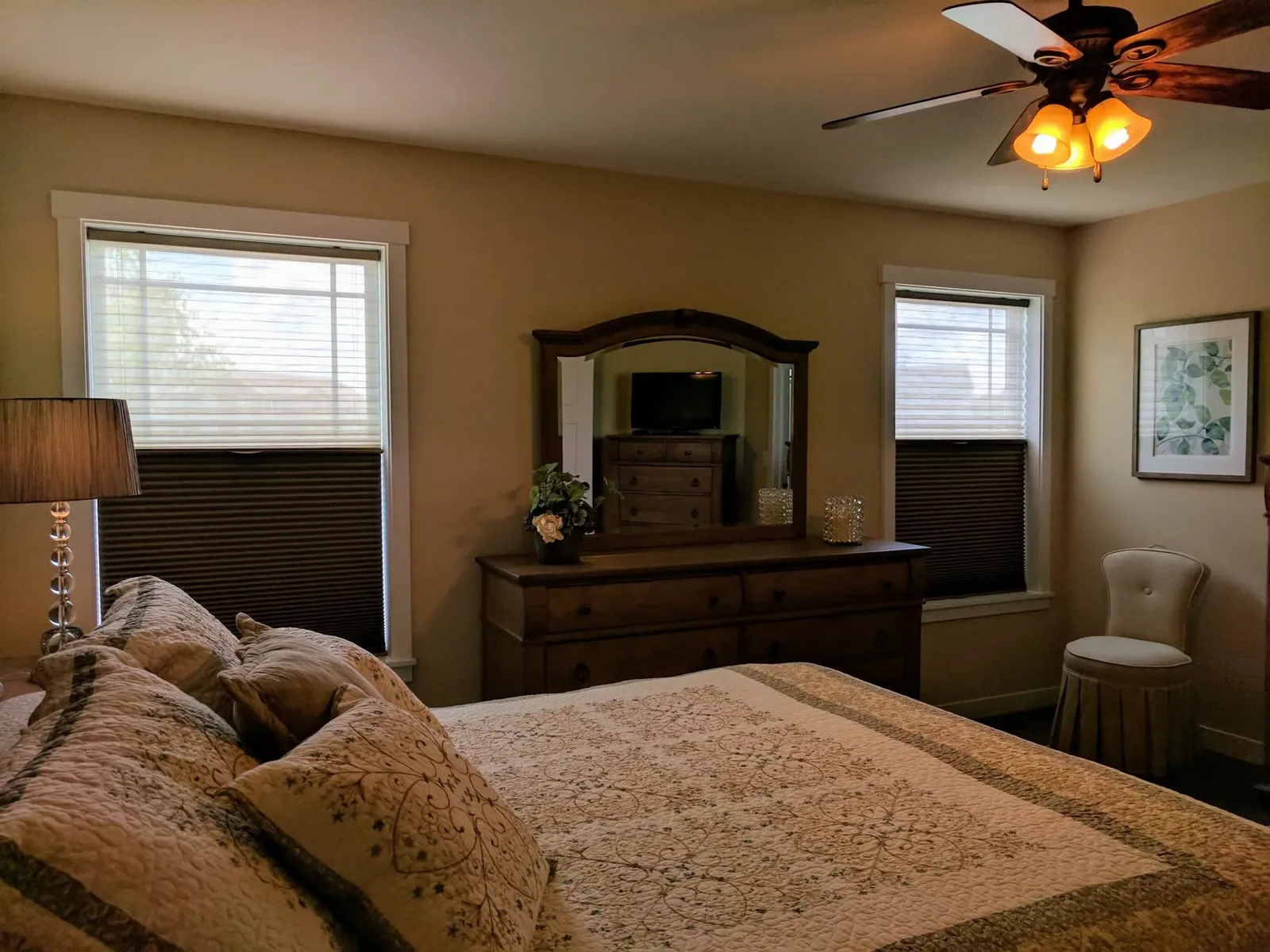 Top down bottom up honeycomb shades open on bedroom windows, installed by Solar Shield Blinds