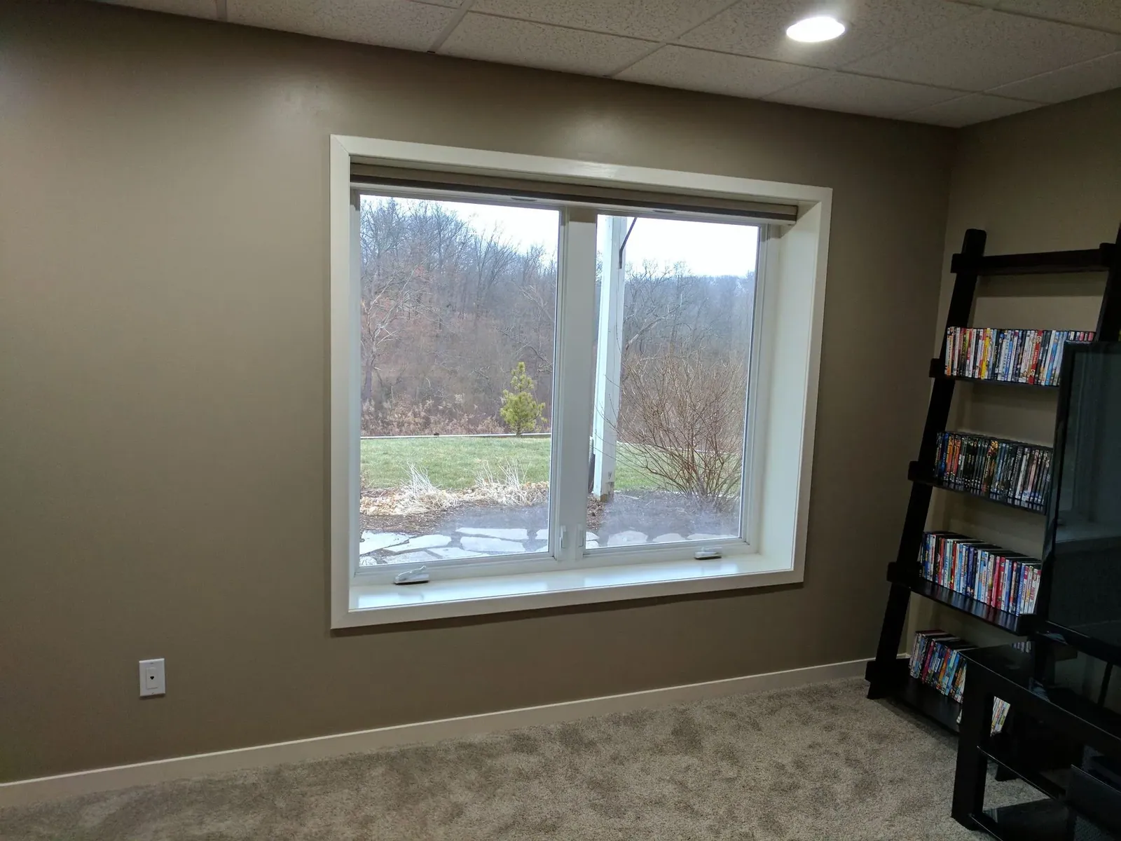 Honeycomb shades open window in office, installed by Solar Shield Blinds