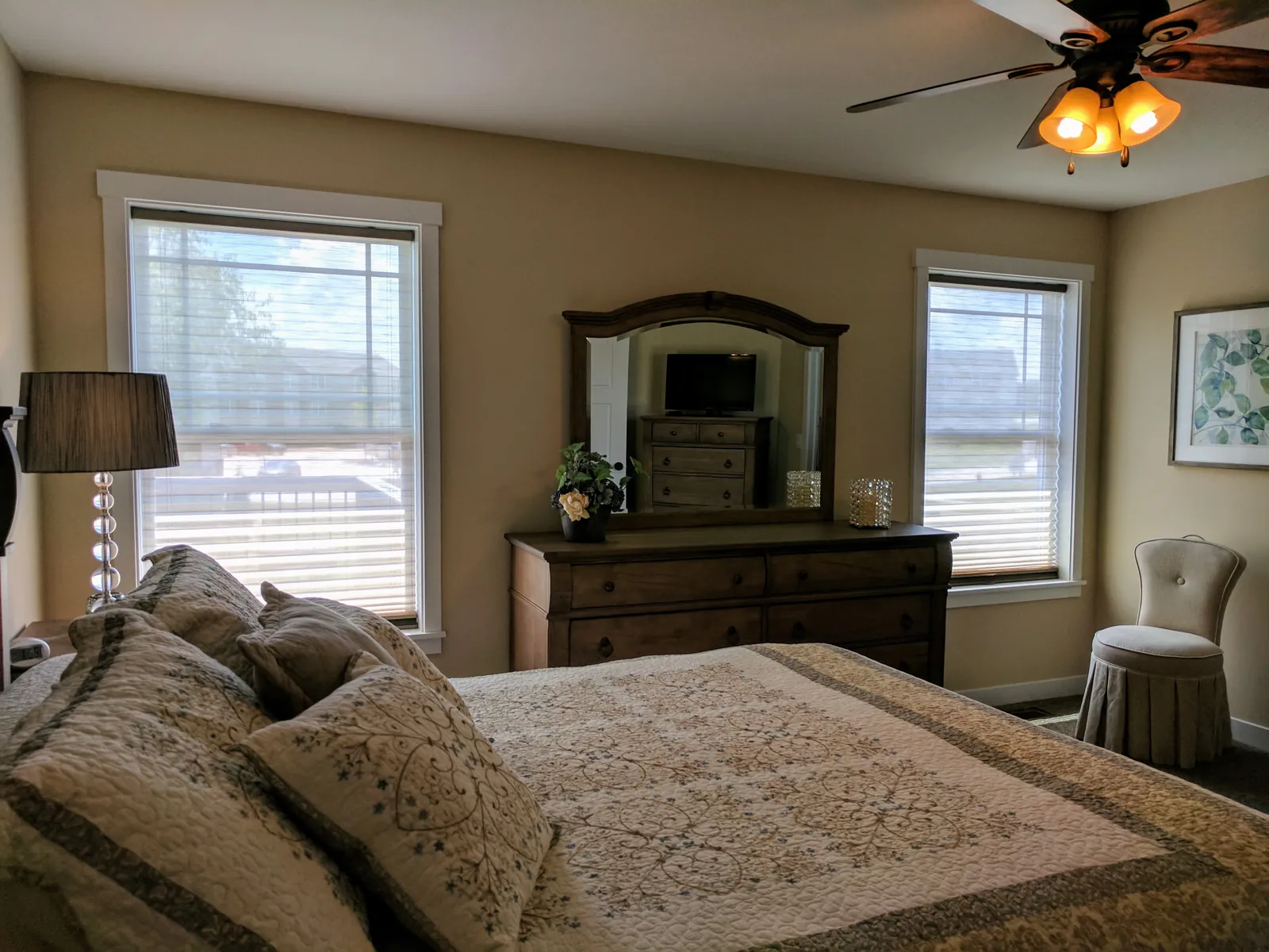 TriLight Shades with the sheer lowered on two bedroom windows, installed by Solar Shield Blinds