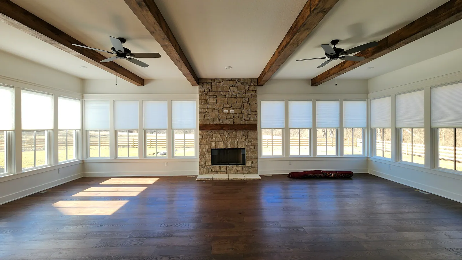 Open honeycomb shades in living room, installed by Solar Shield Blinds
