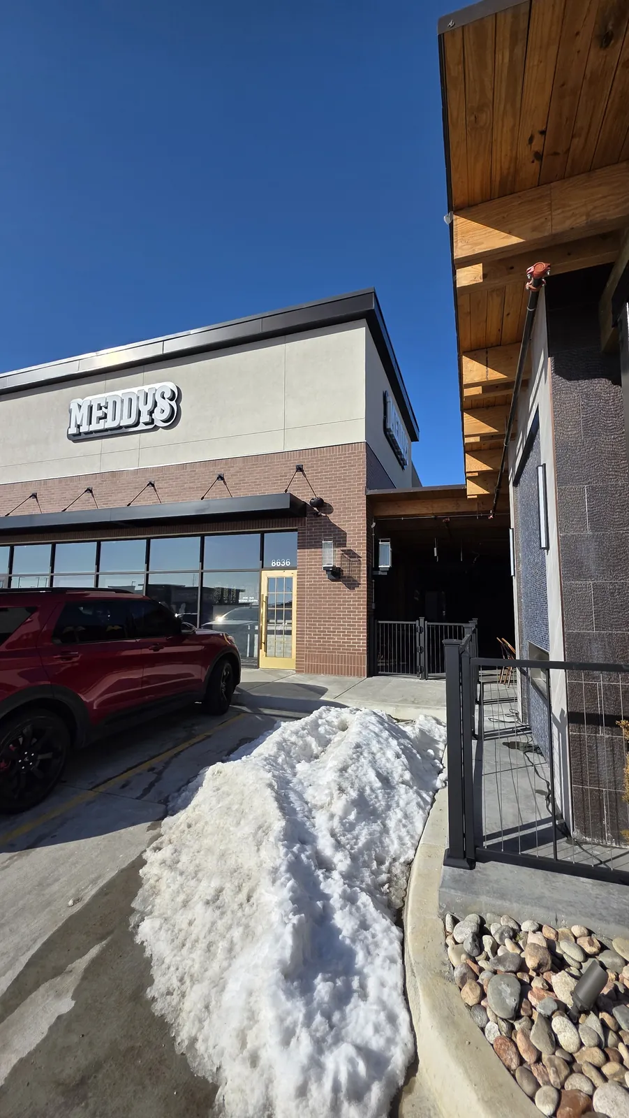 Meddy's restaurant in Kansas City with snow piled along the patio wall