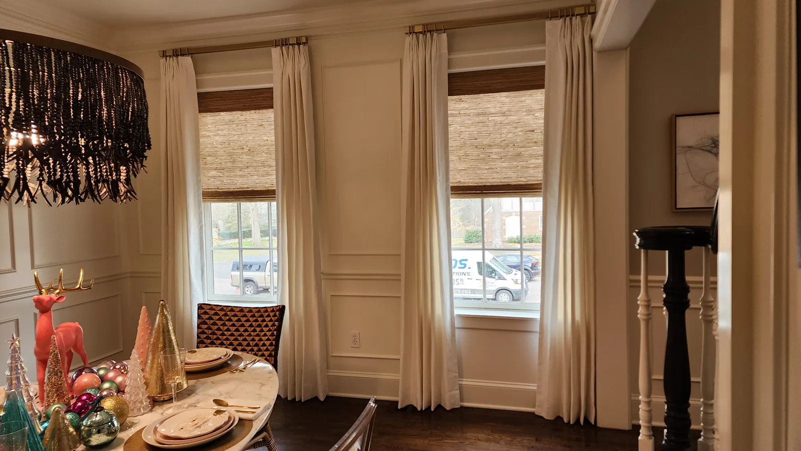 Natural Woven Shades under dining room drapery, a Solar Shield Blinds install