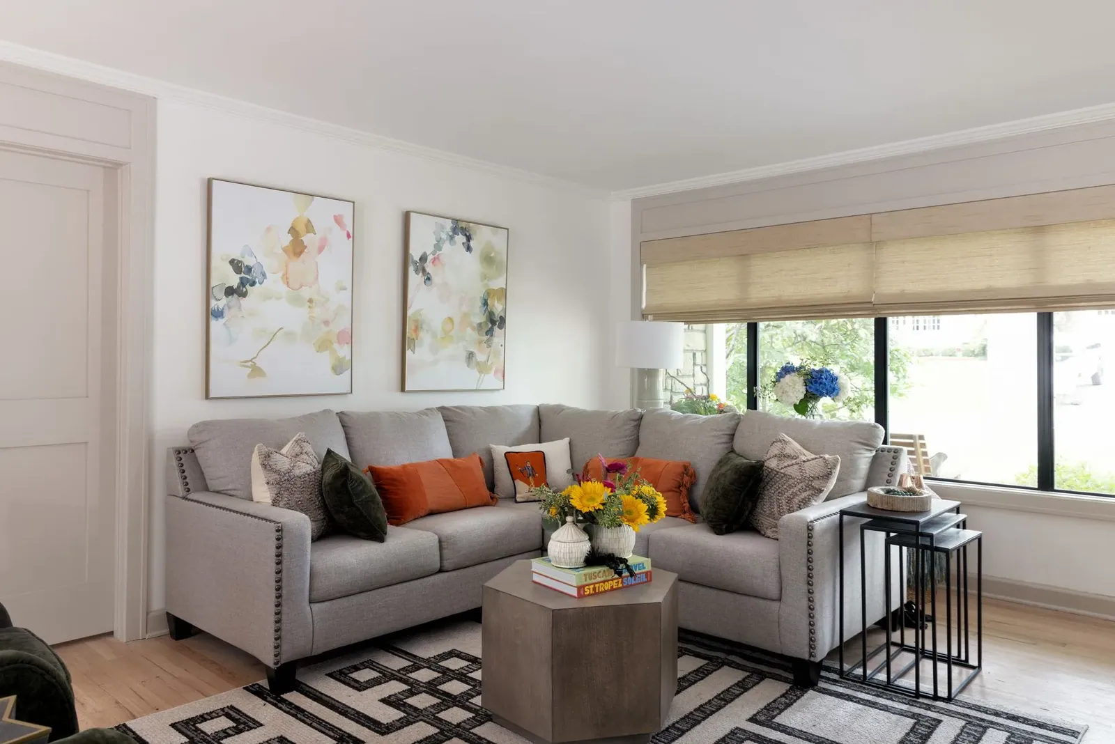 Natural Woven Shades in a living room, a Solar Shield Blinds install