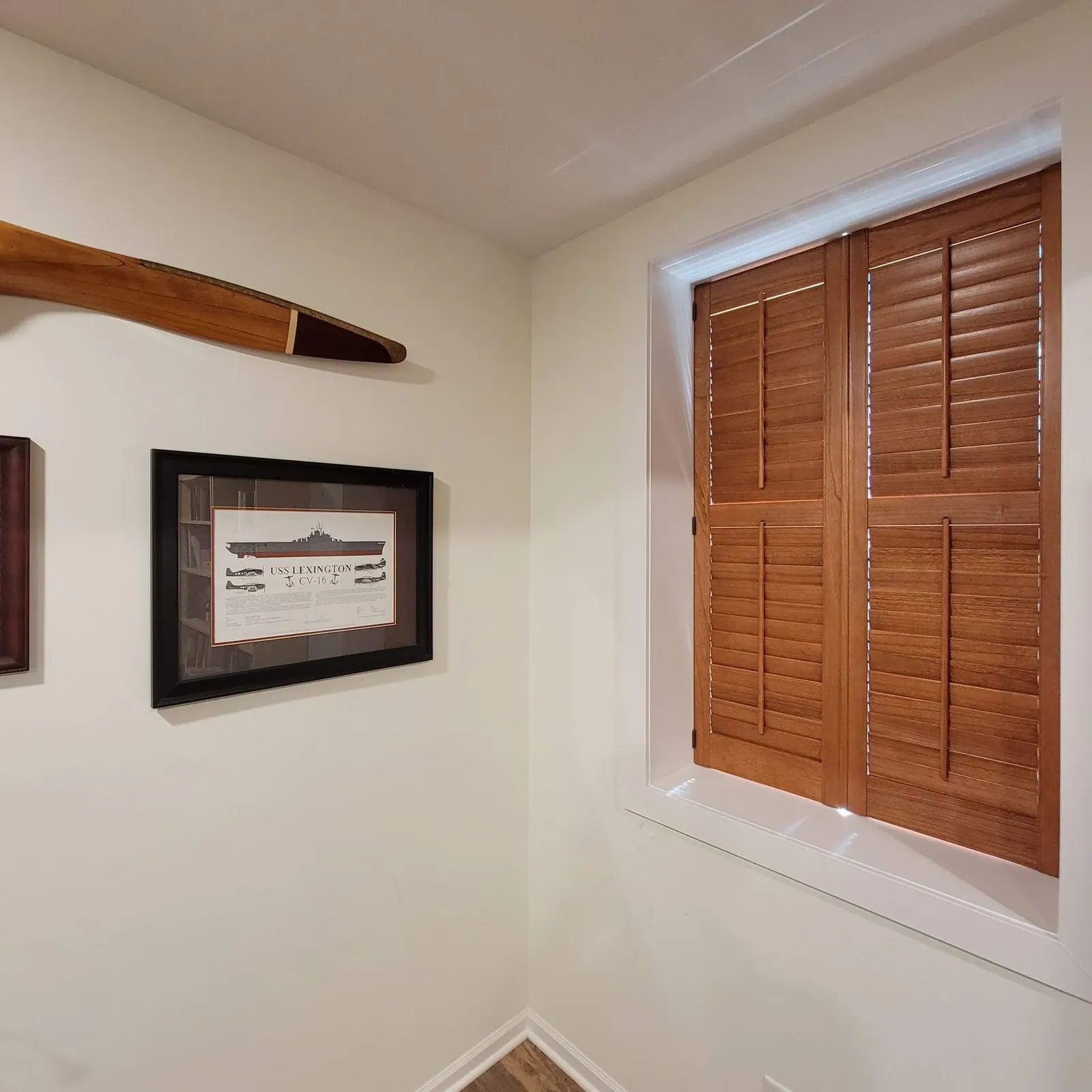 Custom plantation shutters closed planation in a bedroom, installed by Solar Shield Blinds