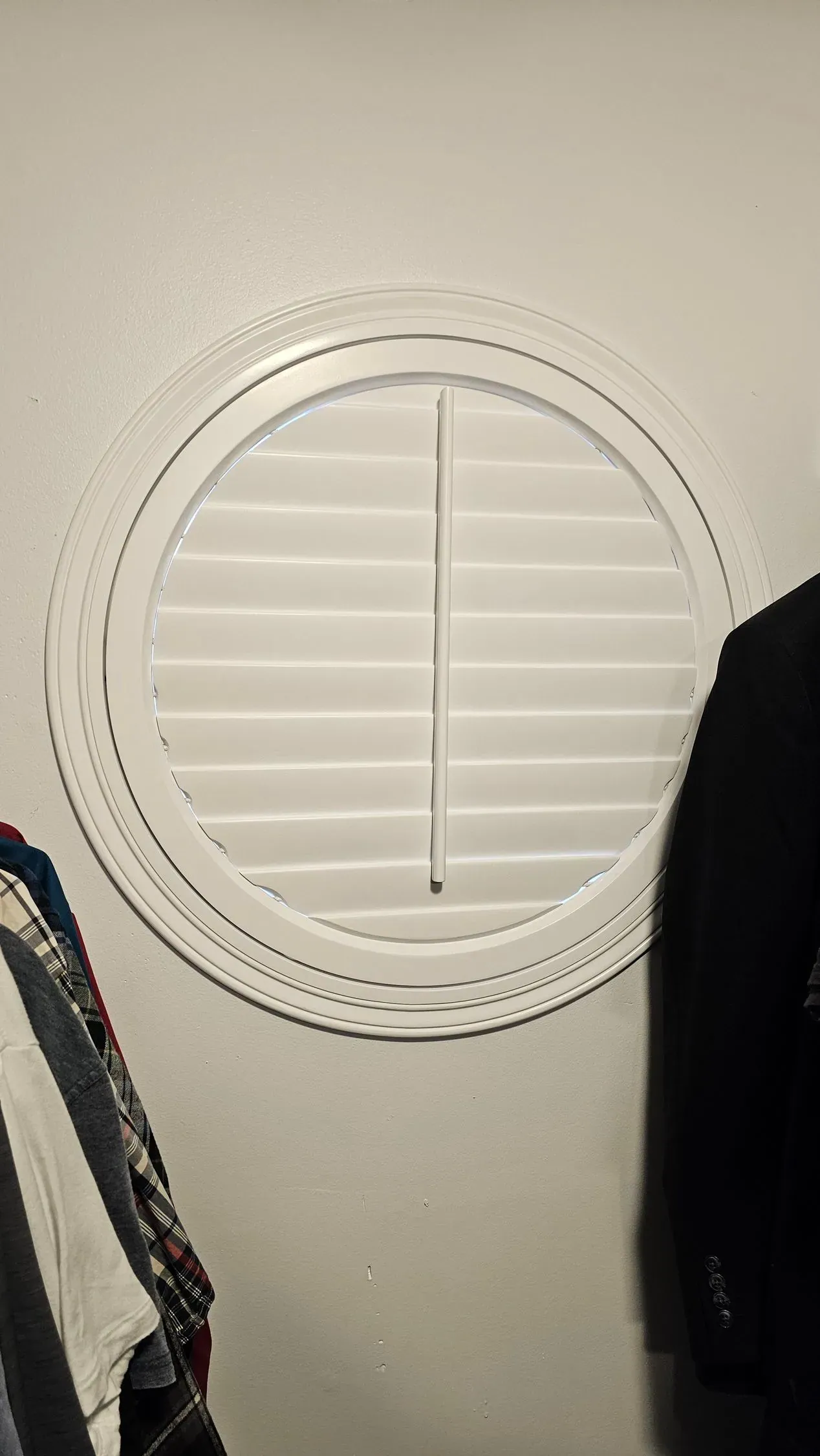 Plantation Shutters hand crank in a bedroom closet, measured and hung by Solar Shield Blinds
