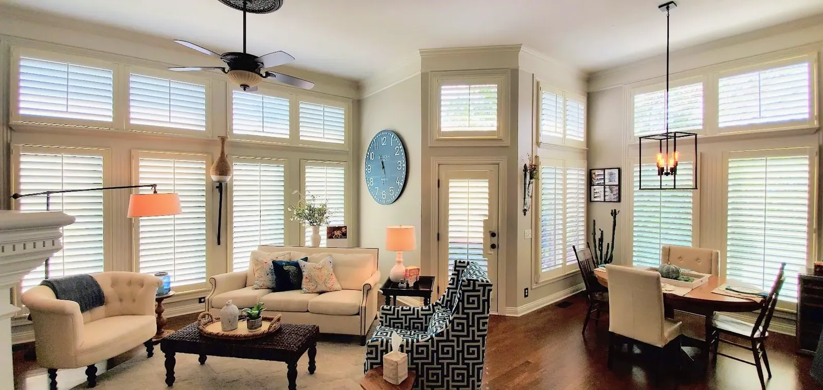 Custom plantation shutters living room dining room tall ceilings, installed by Solar Shield Blinds