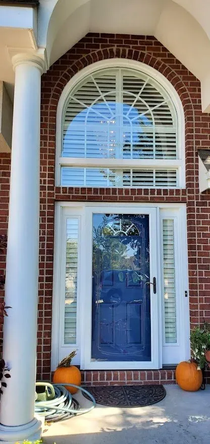 Plantation Shutters above front door sidelight, a Solar Shield Blinds install