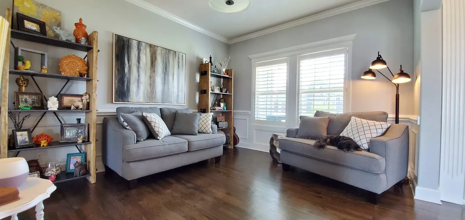 Plantation shutters in living room, installed by Solar Shield Blinds