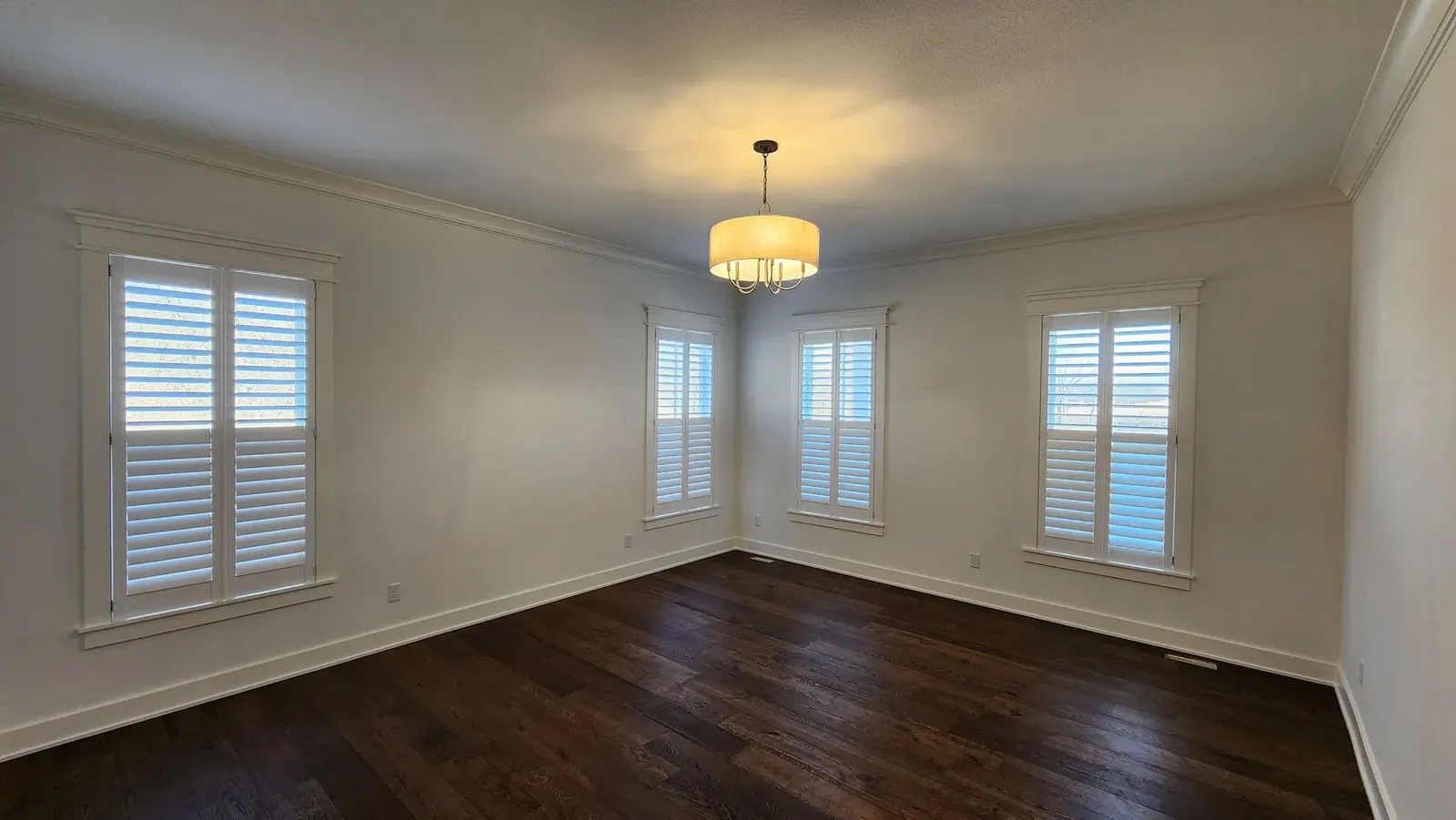 Plantation shutters open room, installed by Solar Shield Blinds