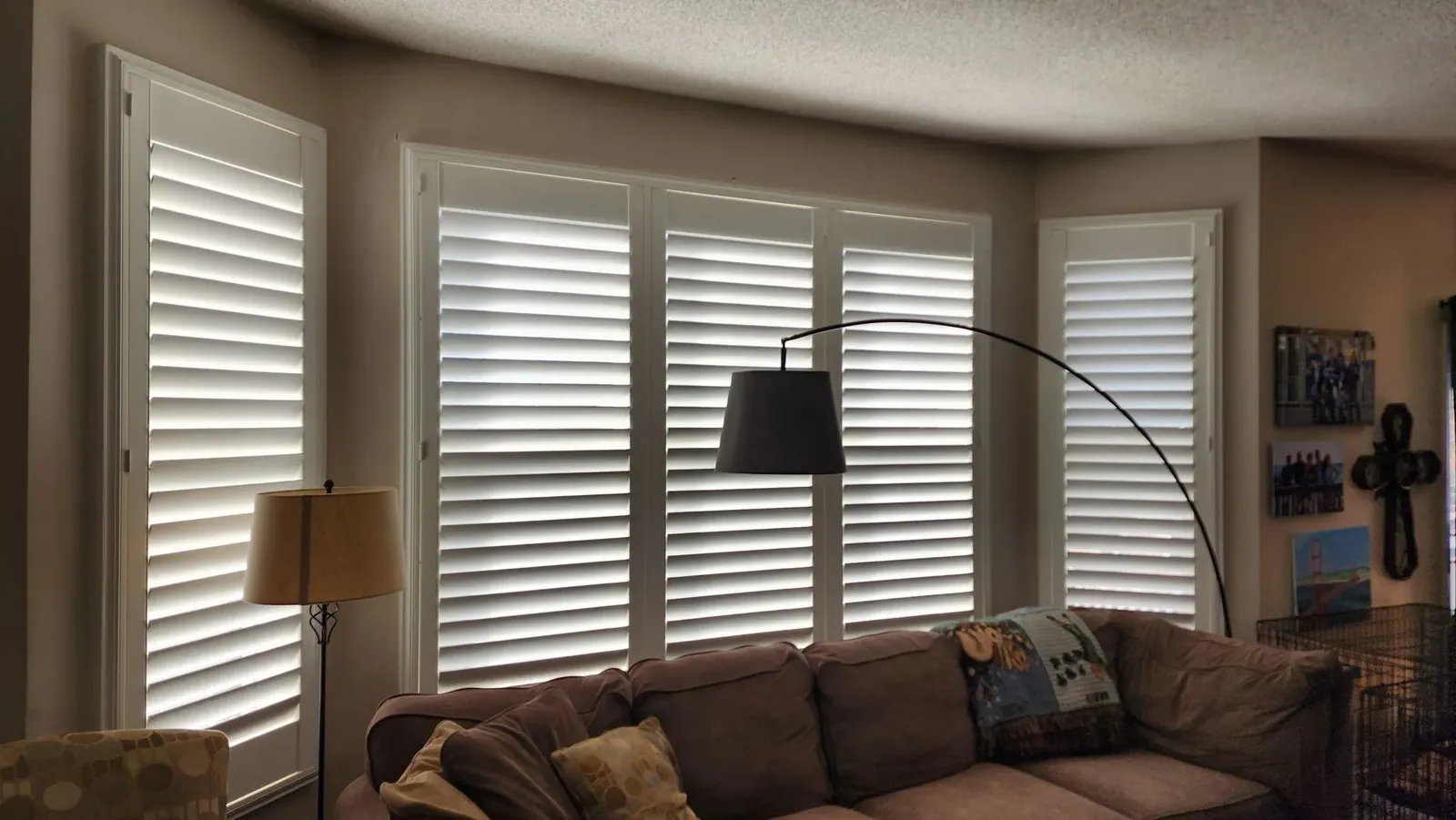 Plantation shutters in living room, installed by Solar Shield Blinds