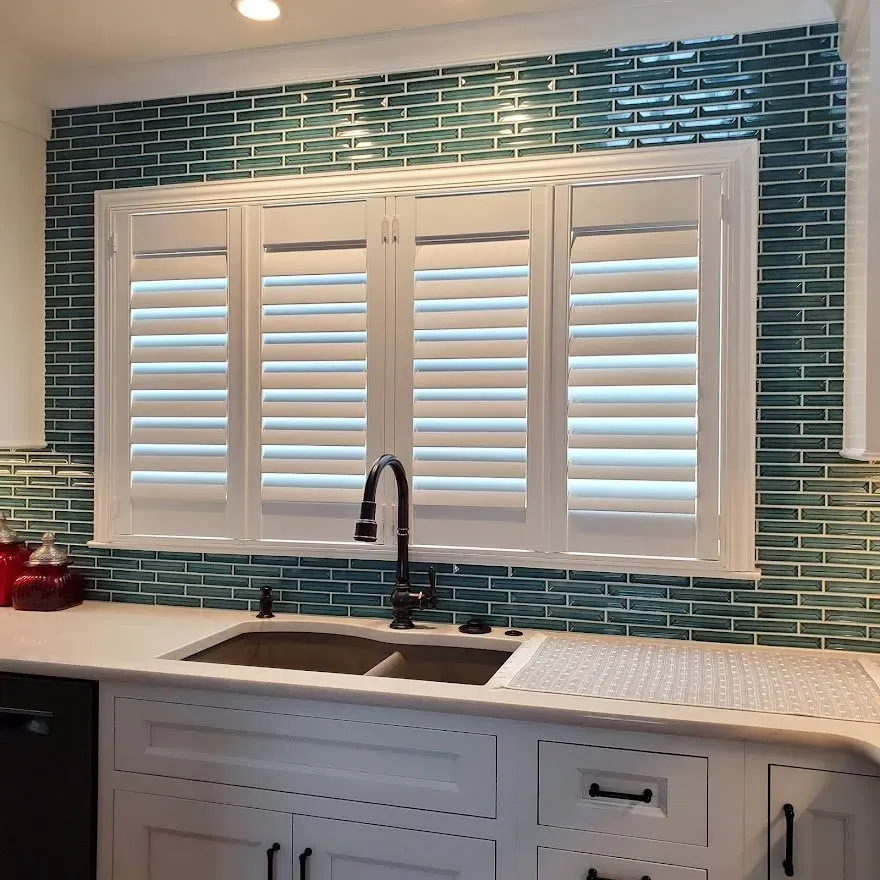 Plantation shutters above a kitchen sink