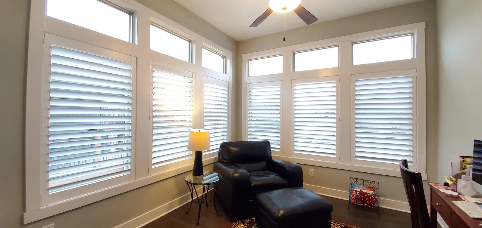 Plantation shutters in living room, installed by Solar Shield Blinds