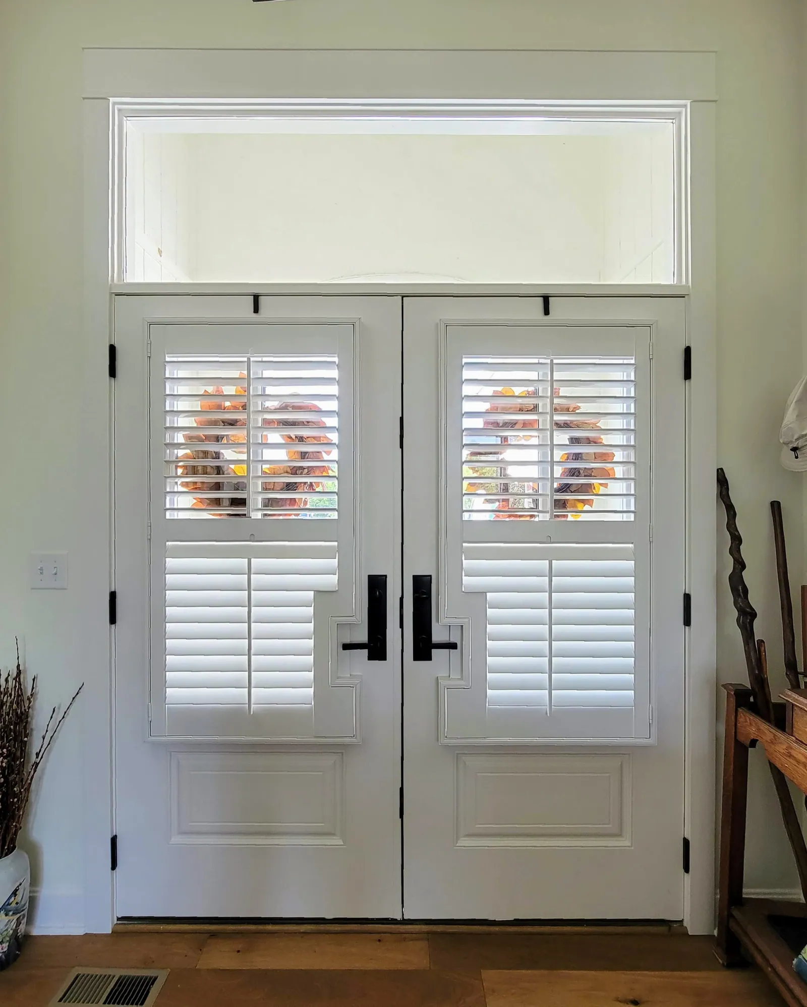 Plantation shutters on french door cut out, installed by Solar Shield Blinds