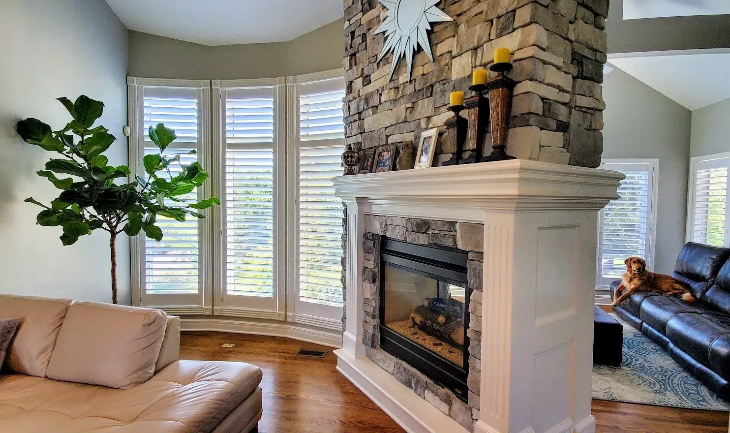 Plantation shutters split living room, installed by Solar Shield Blinds