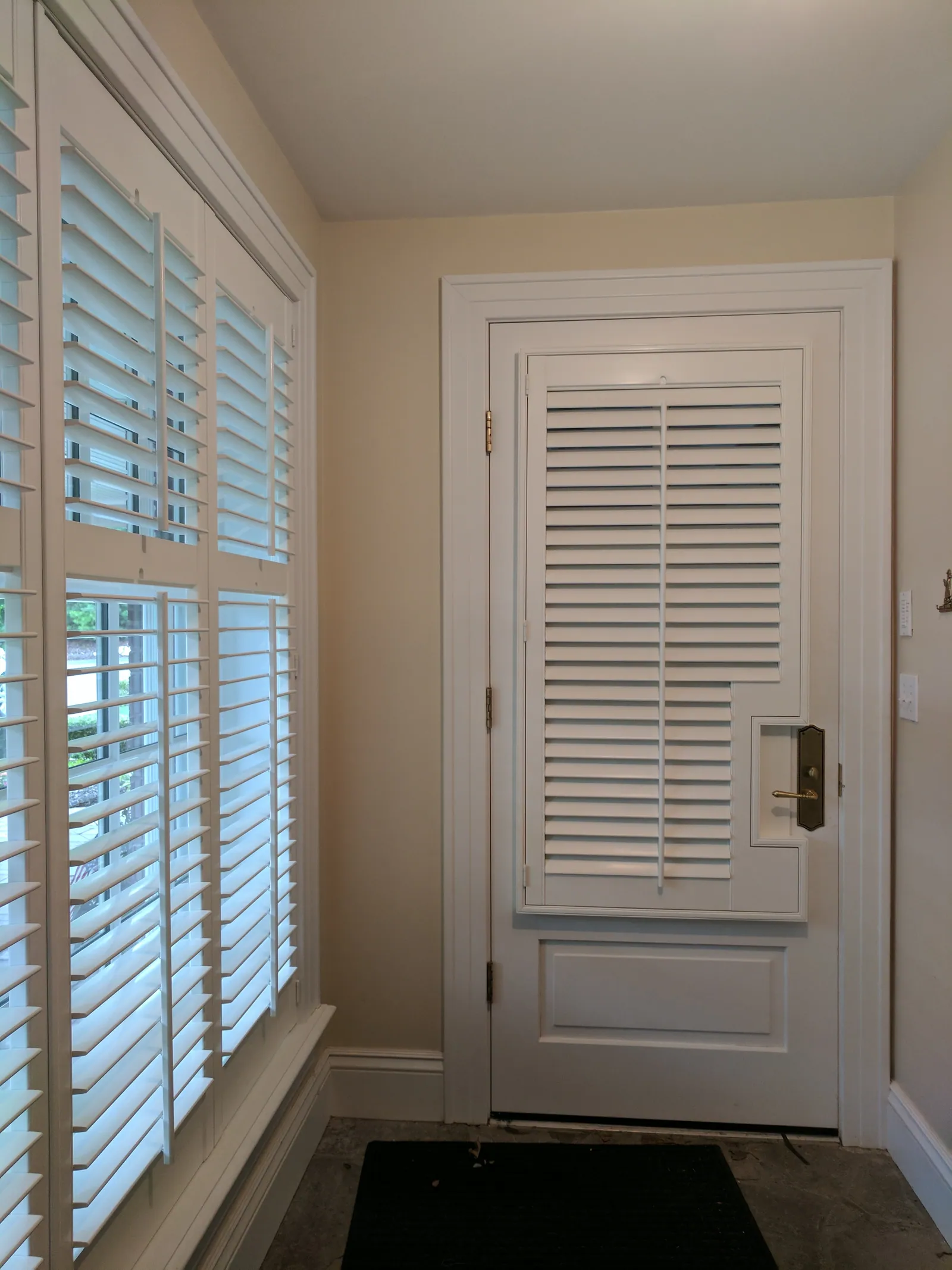 Single door french door plantation shutters cut out, installed by Solar Shield Blinds