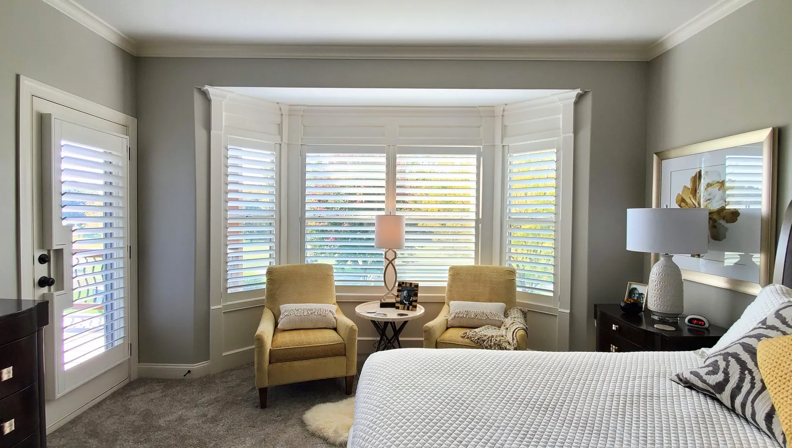 Plantation shutters fitted to a bedroom bay window