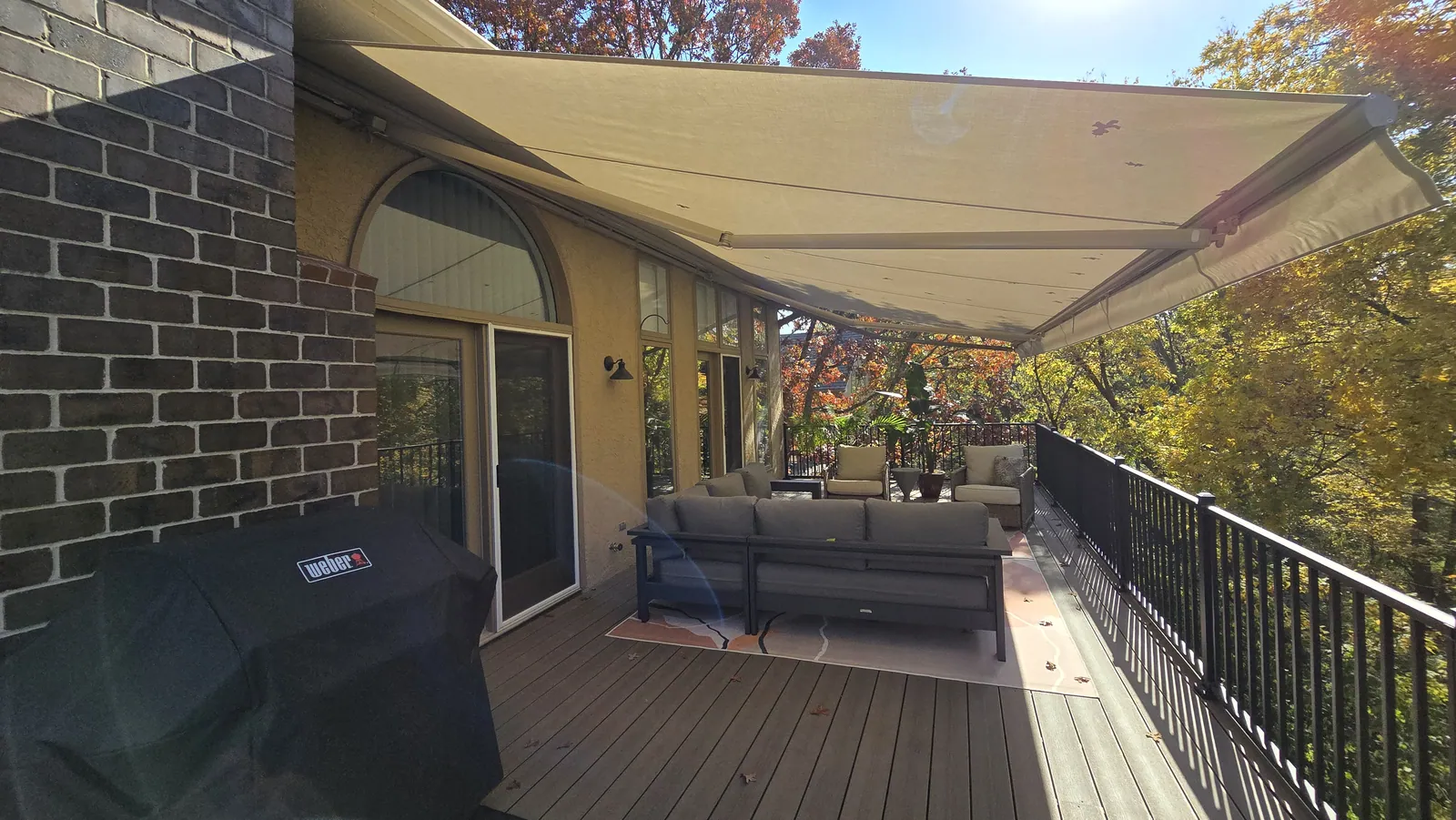 A retractable awning extended over a patio