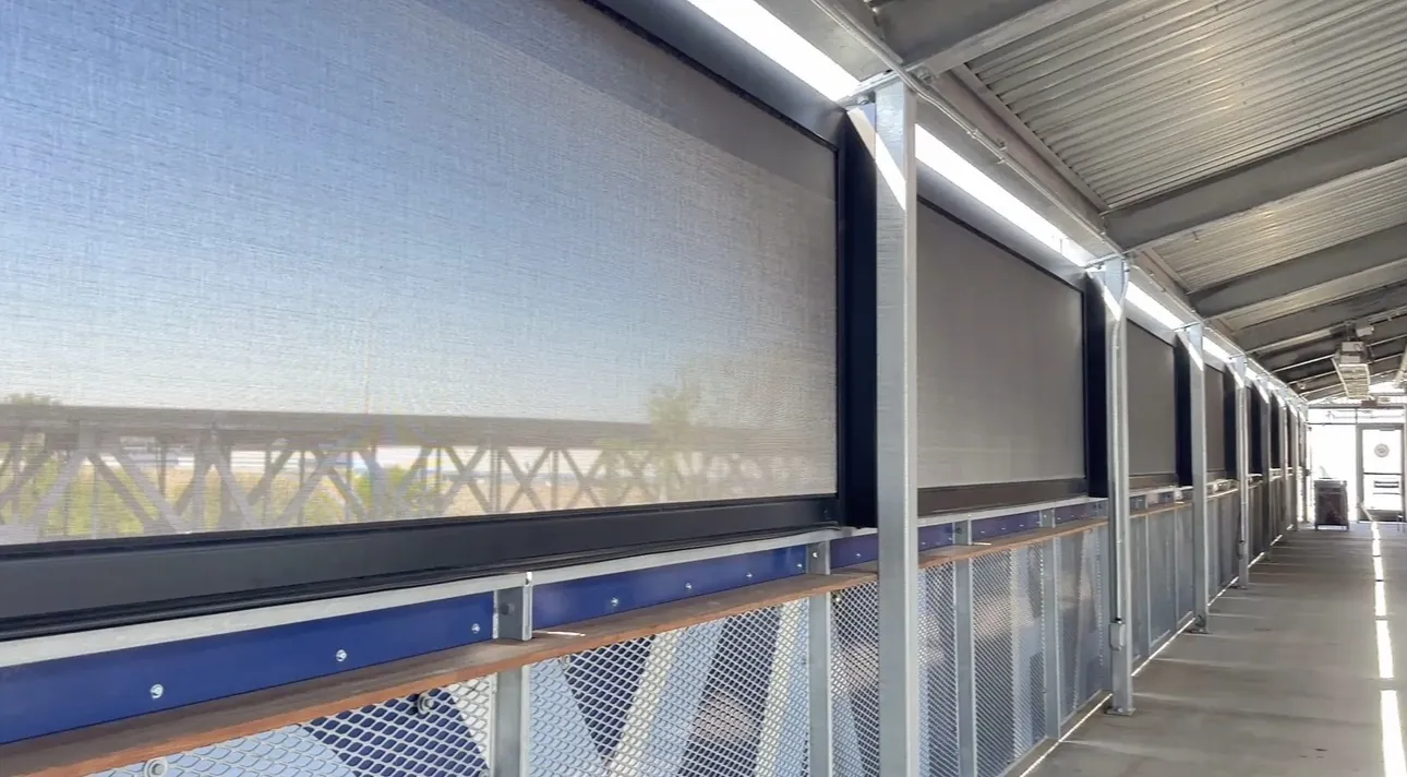 A row of lowered screens along the railing